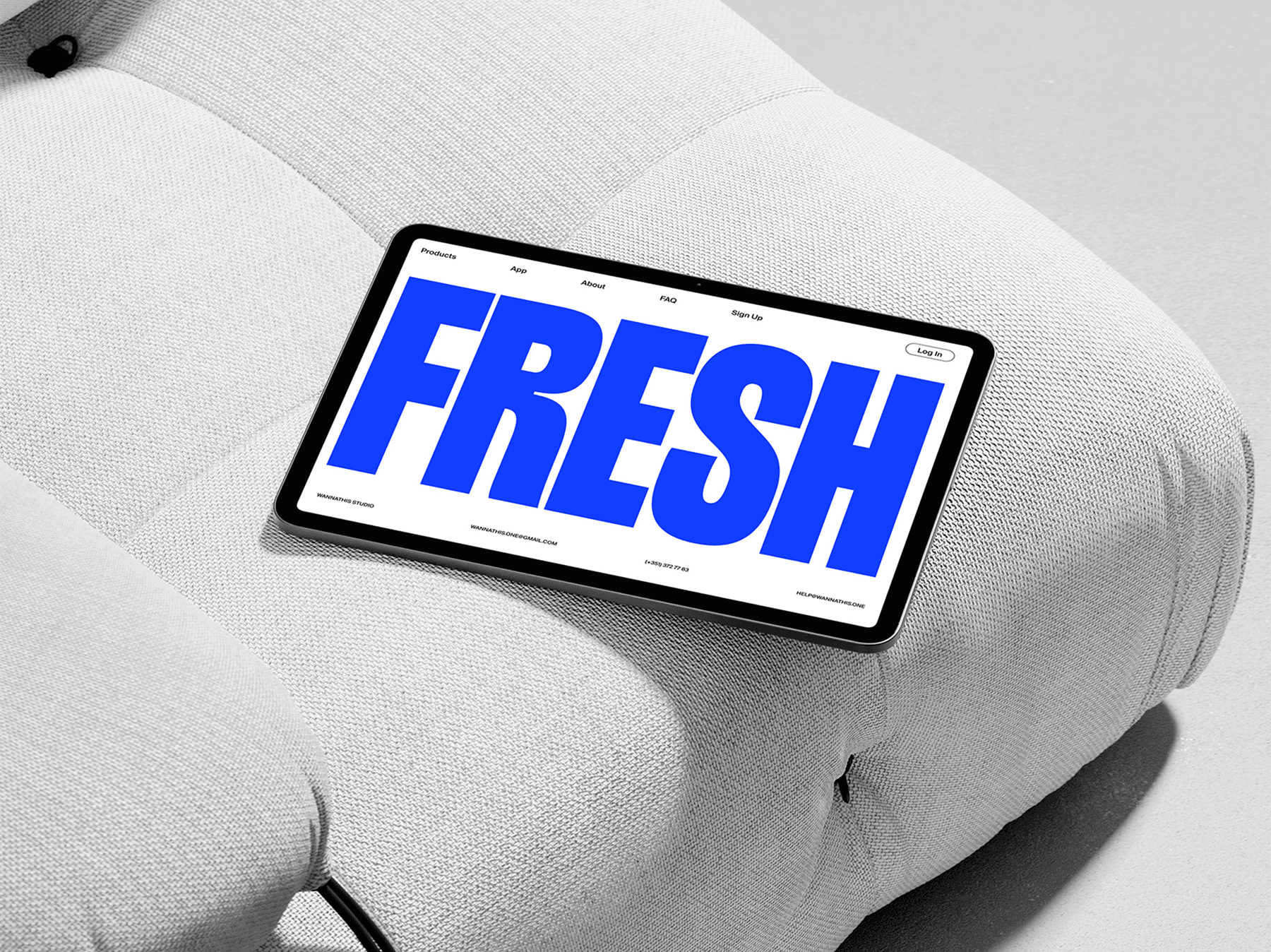 Tablet mockup positioned on a soft white cushion