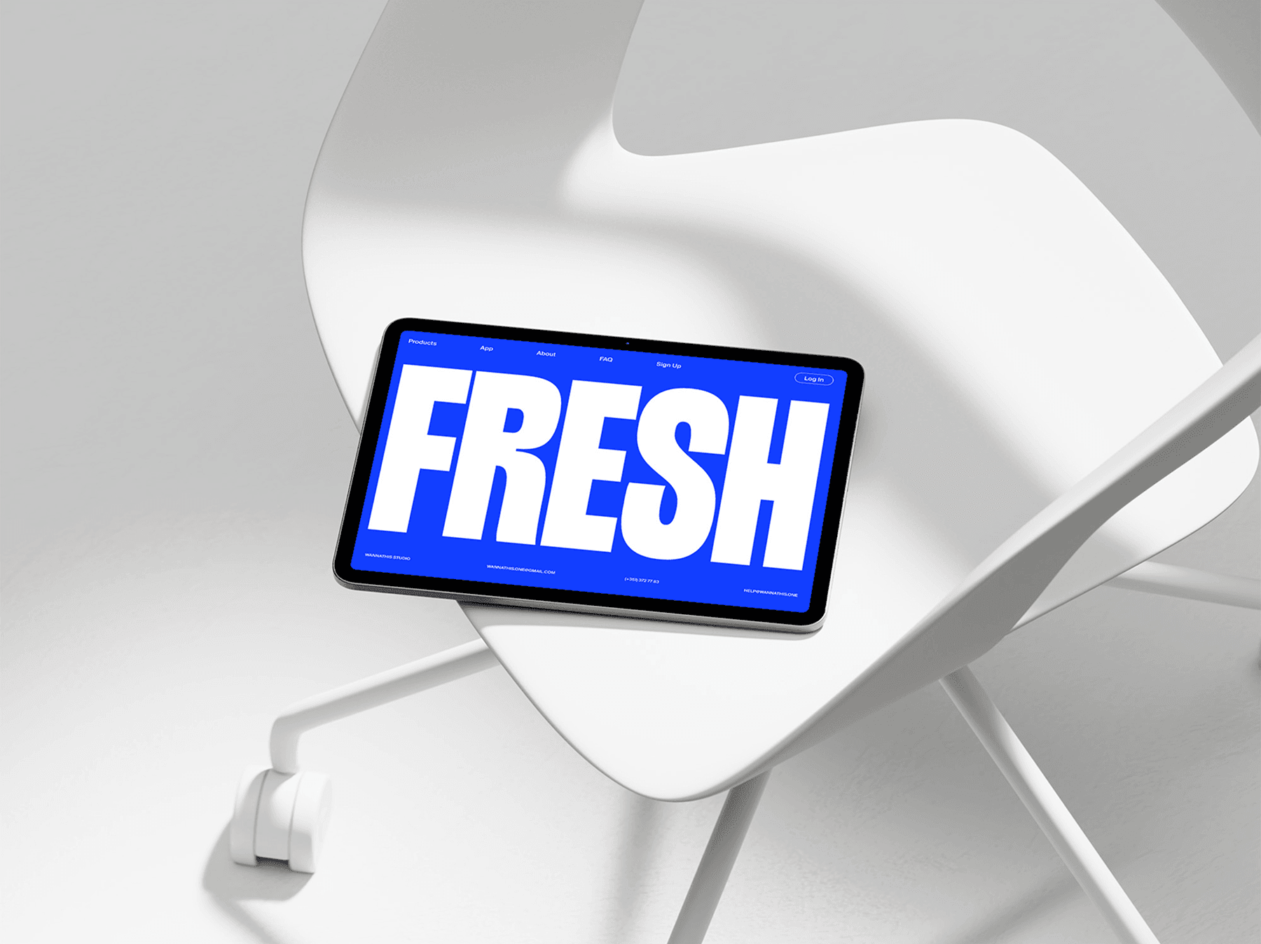 Tablet mockup placed on a sleek white chair in a minimal setup