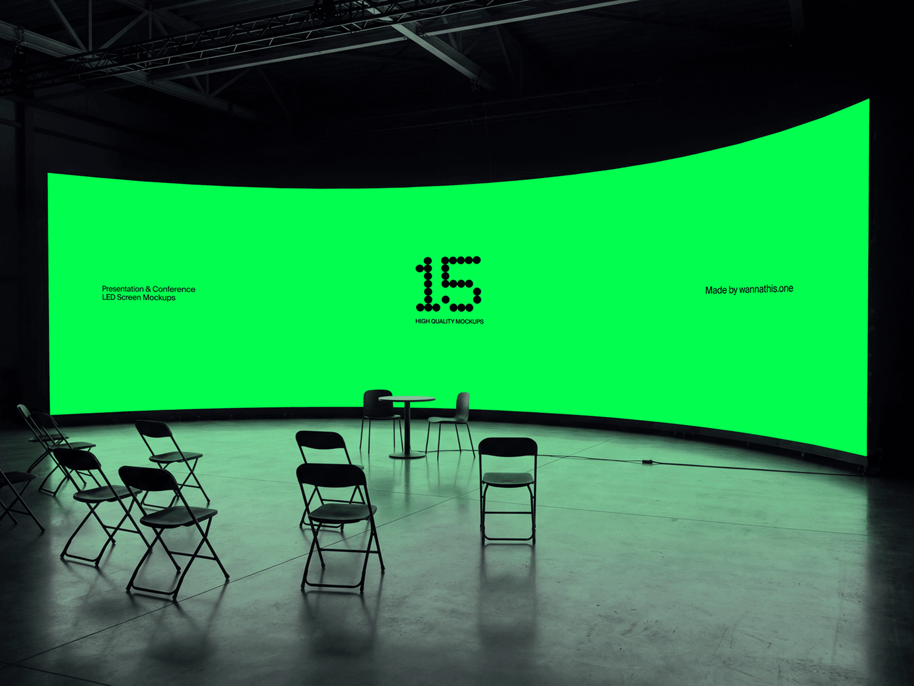 Wide curved LED screen with chairs arranged in front for an event setup