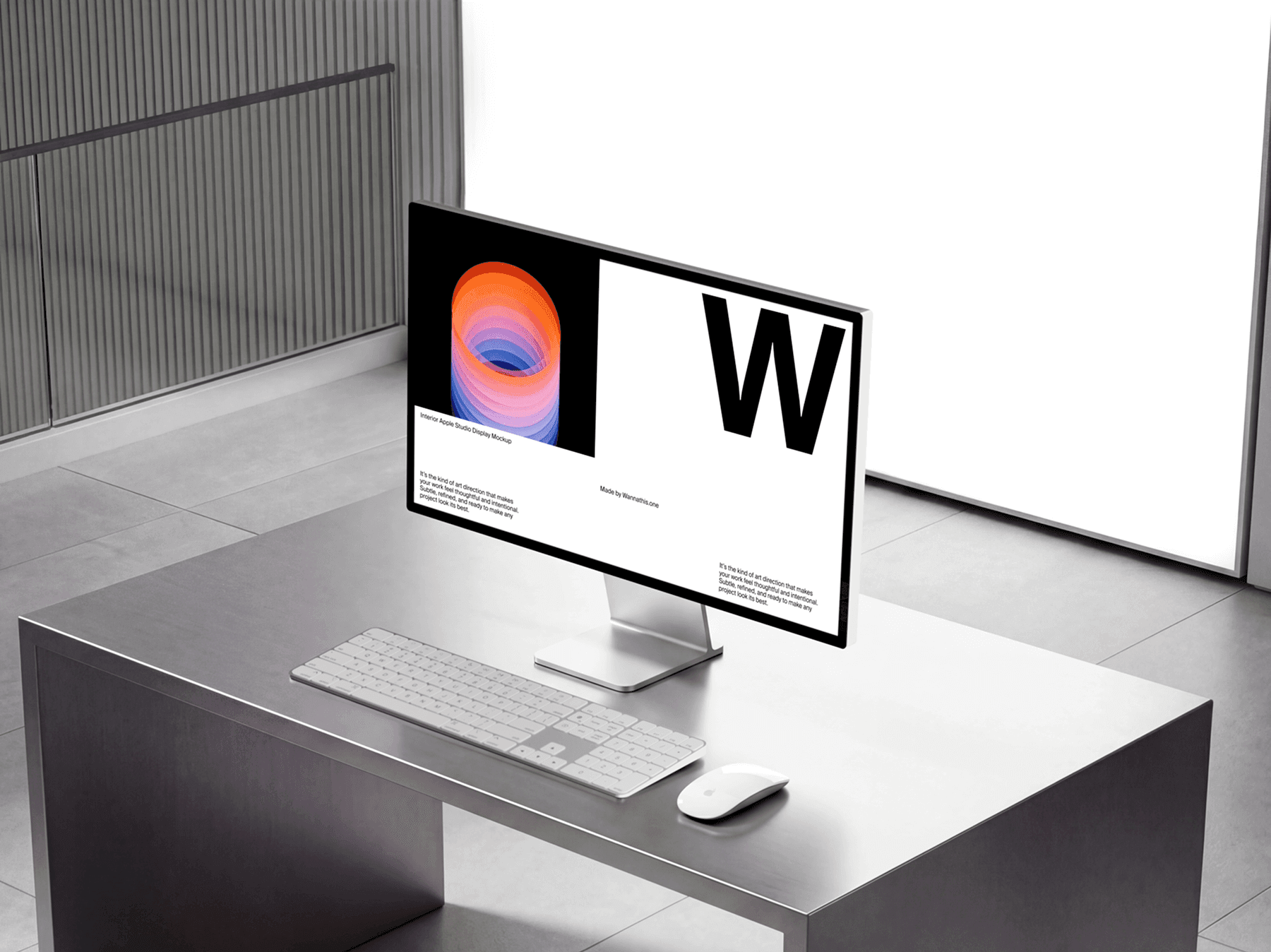 Studio display monitor on a desk with keyboard and mouse in a minimal office space