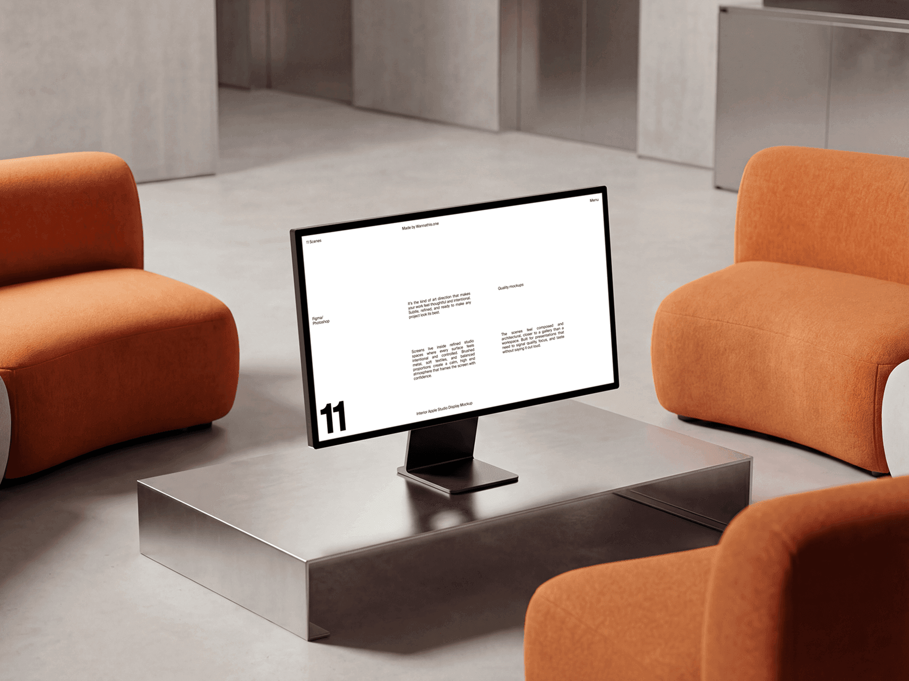 Studio display monitor placed on a low table between lounge chairs