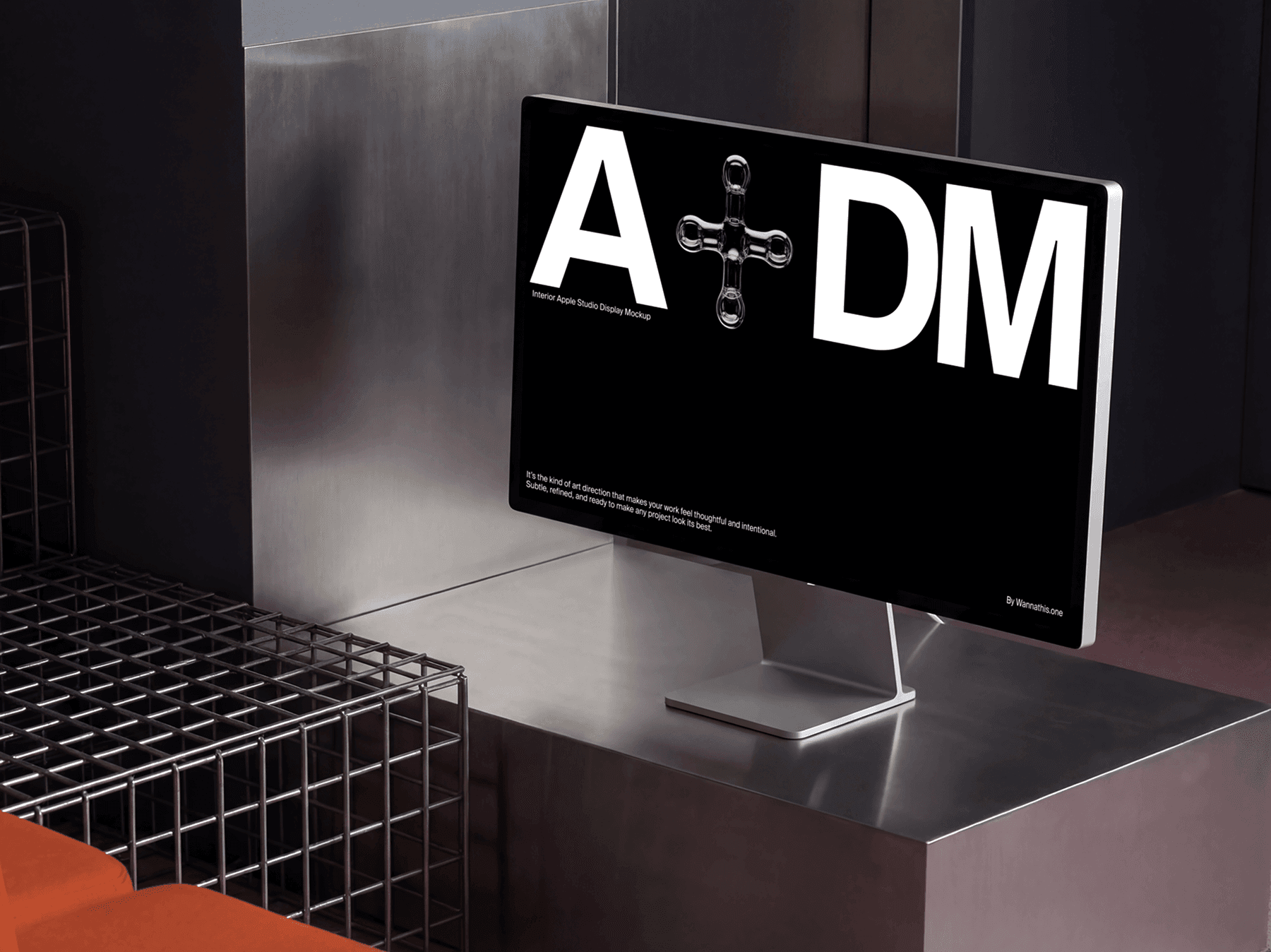Studio display monitor positioned on a metal counter in a modern interior