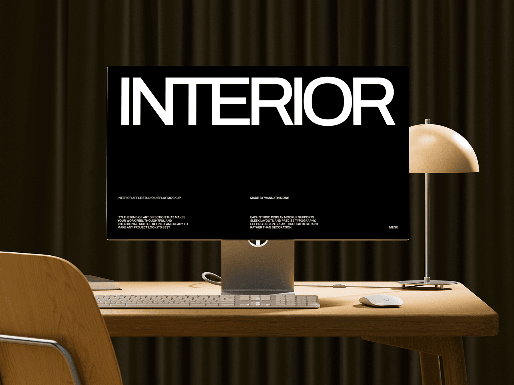 Studio display monitor on a desk with a lamp and chair in a modern interior