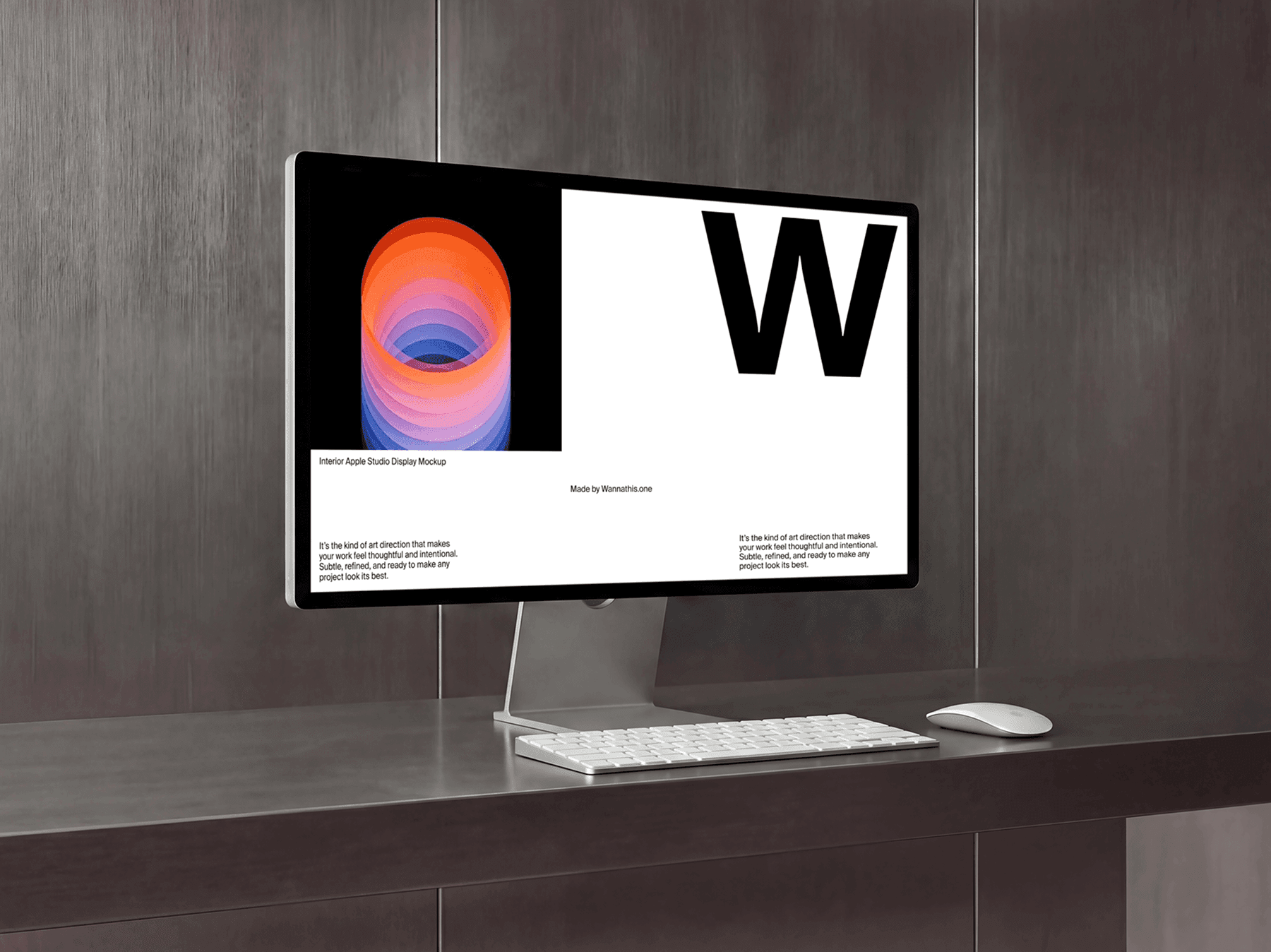 Studio display monitor on a desk with keyboard and mouse