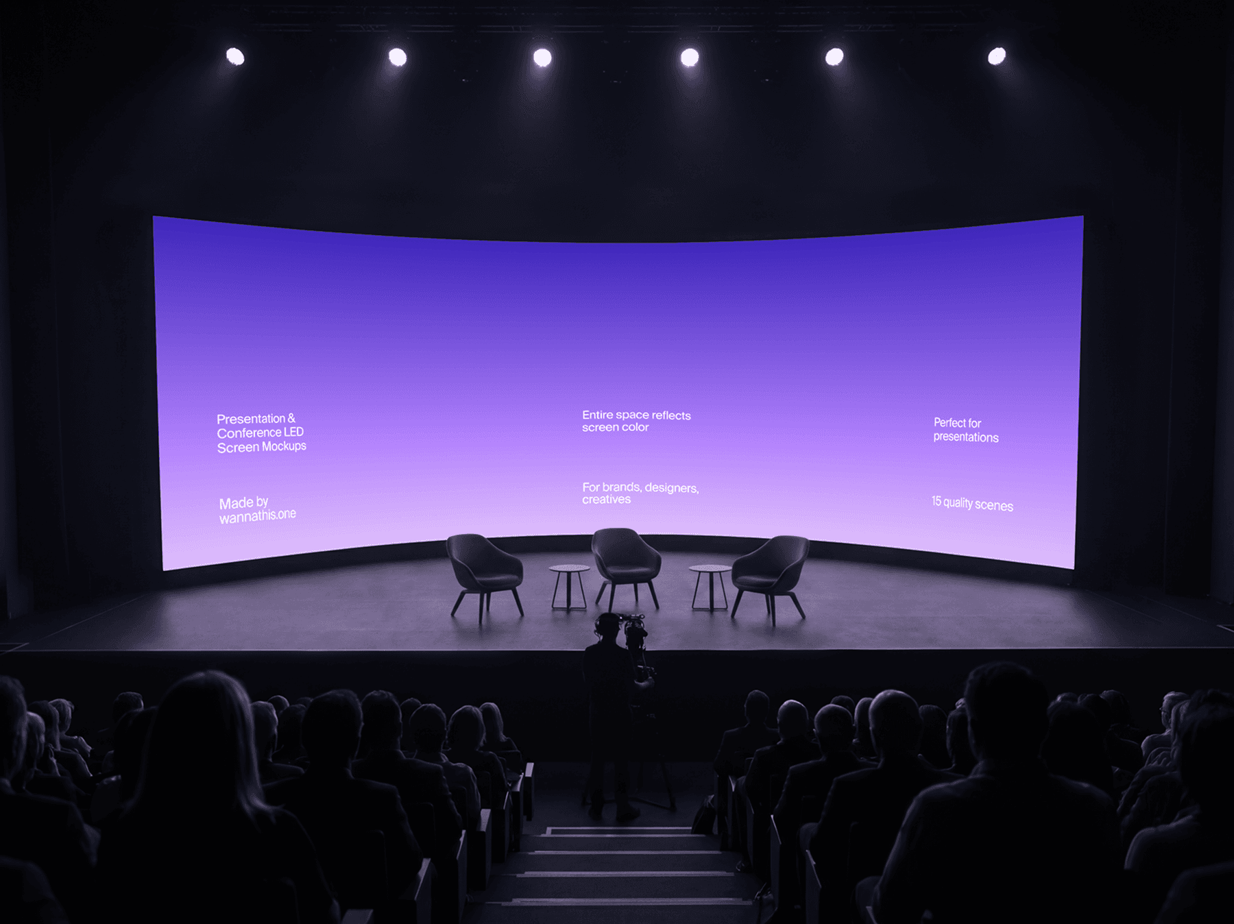 Curved LED screen on a stage with chairs and audience area