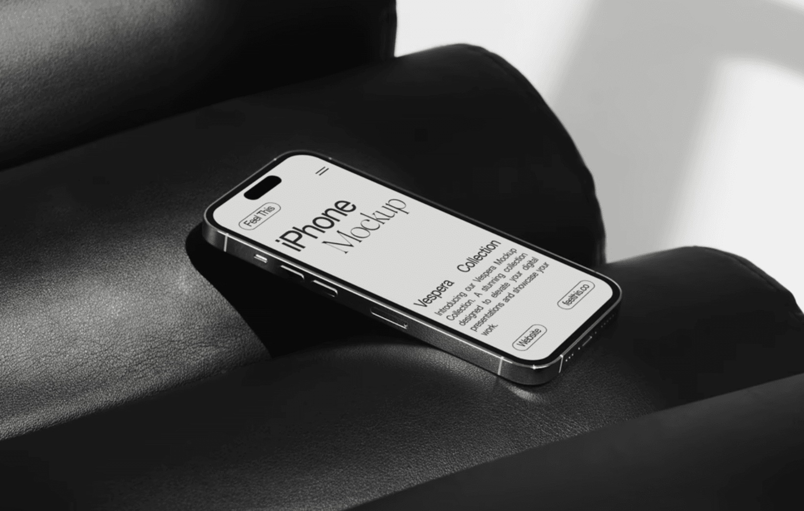 iPhone mockup on black leather couch with soft studio light and elegant interface