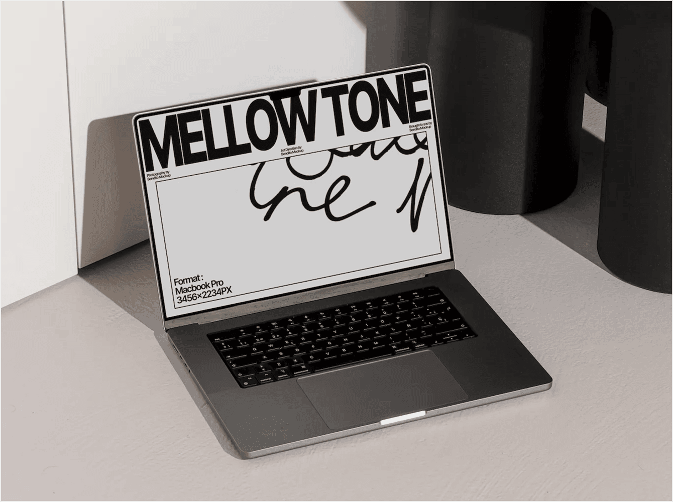 MacBook Pro mockup leaning against white wall and black vases on tiled floor