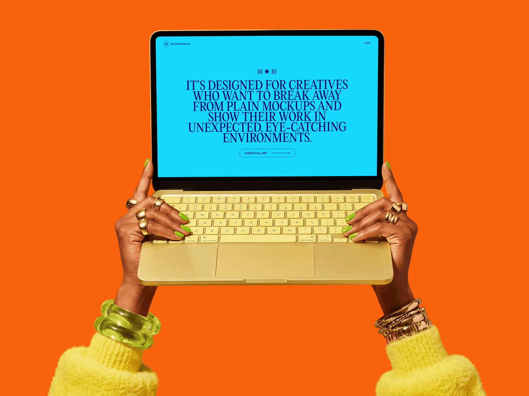 Front view of a MacBook held with both hands in a bold presentation pose