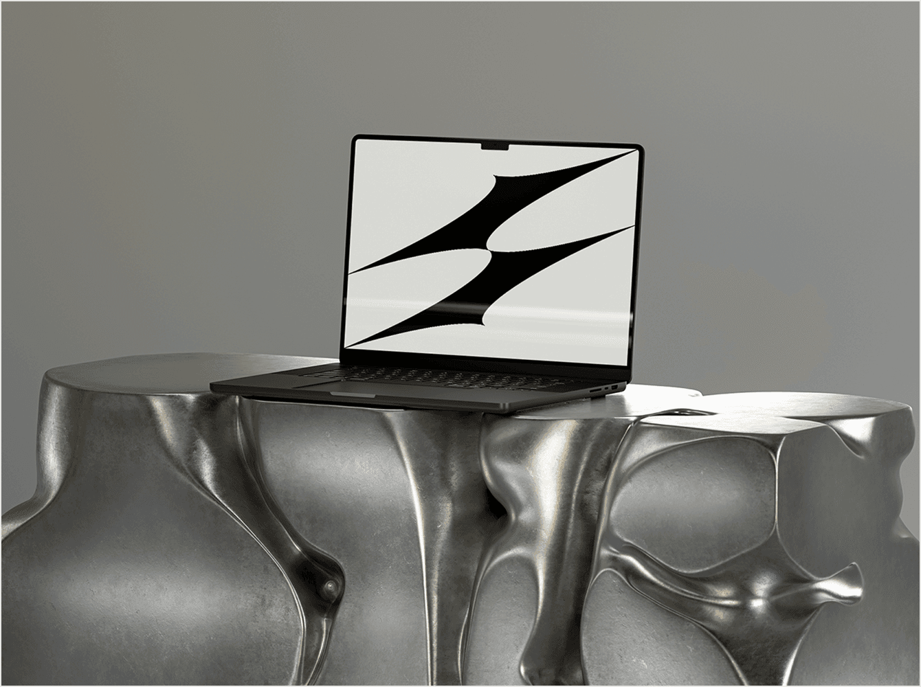 MacBook Pro mockup on sculptural metallic coffee table with soft lighting