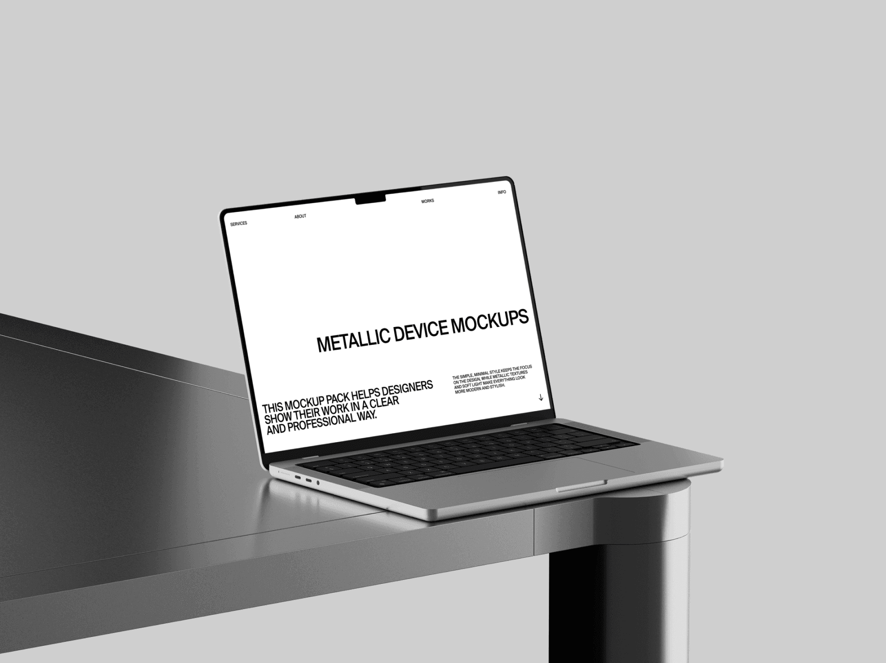 MacBook mockup displayed on the edge of a clean metallic desk