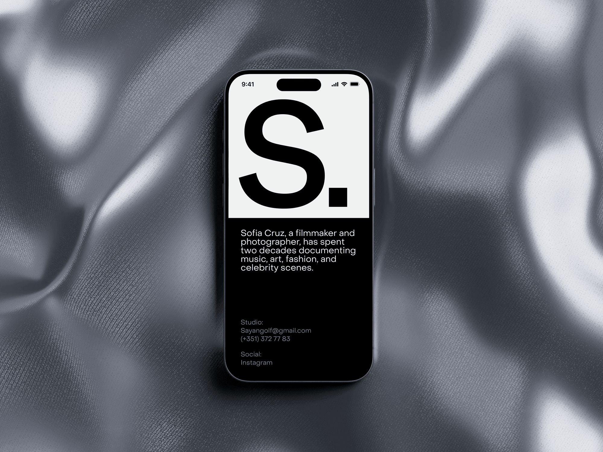 iPhone 15 Pro mockup placed on a luxury black fabric with a subtle shine