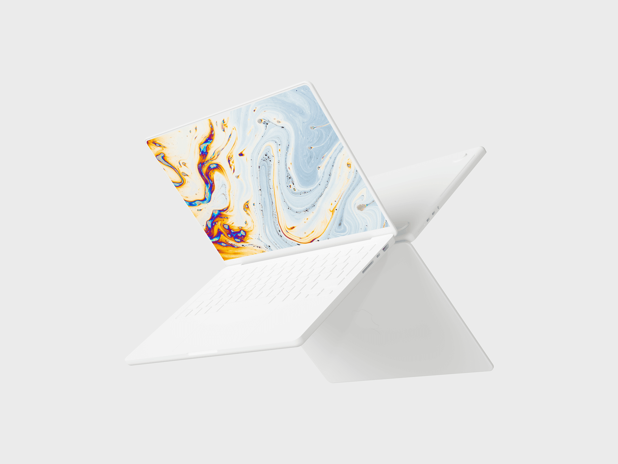 White MacBook Pro in a dynamic composition with another MacBook behind it.