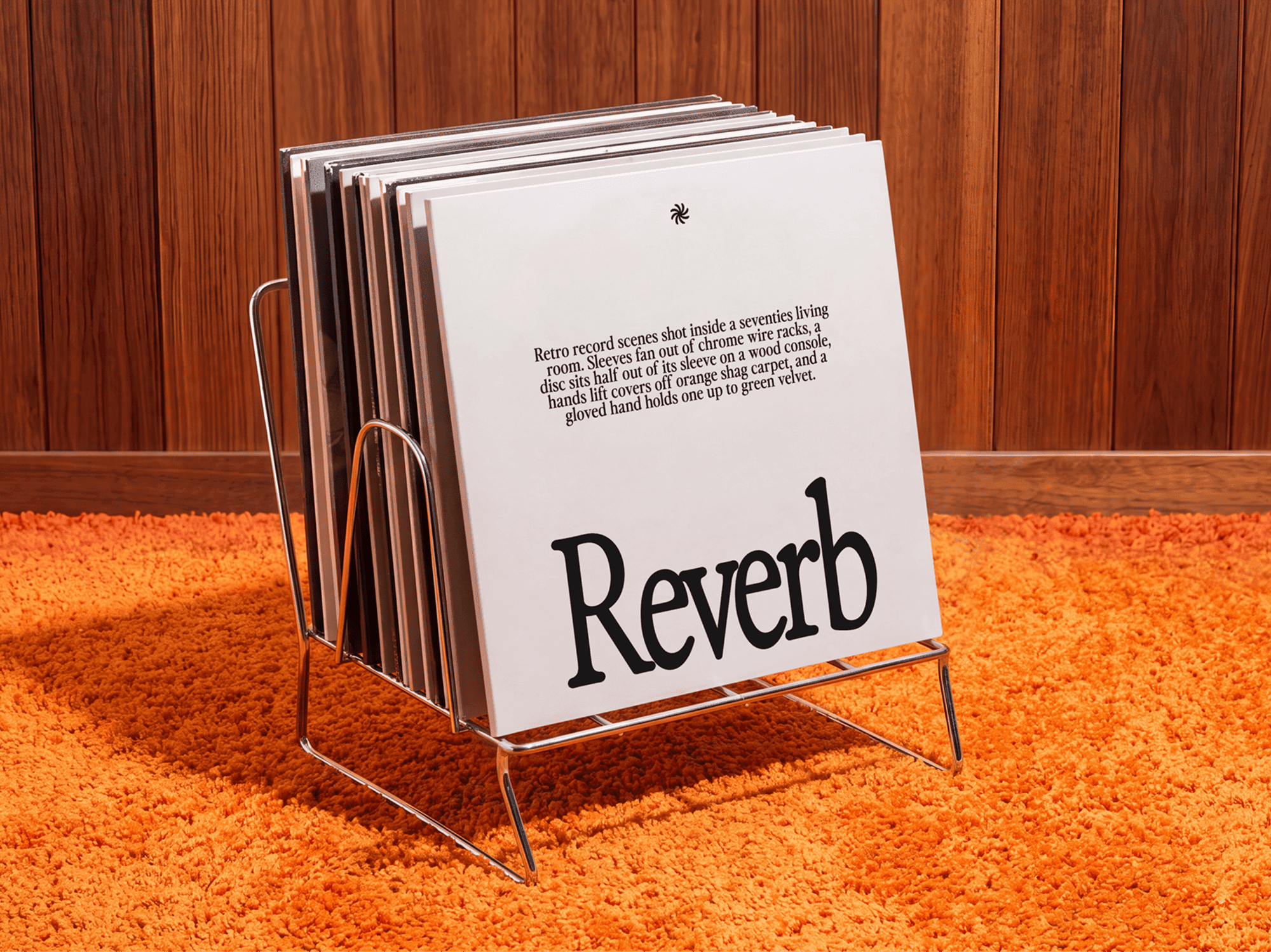 Vinyl record sleeve propped upright in a thin metal record holder