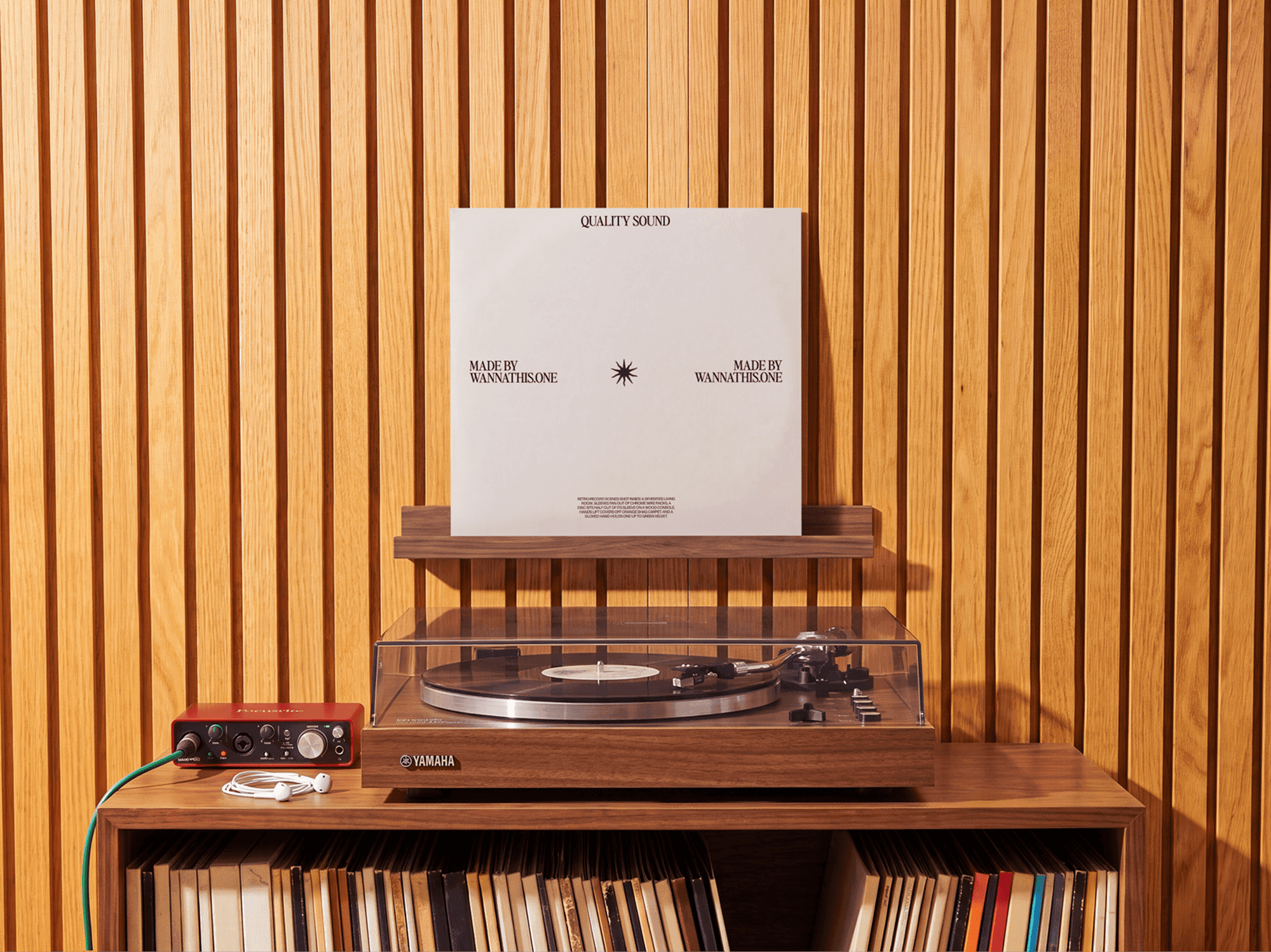 Vinyl record sleeve standing above a turntable in a home listening corner