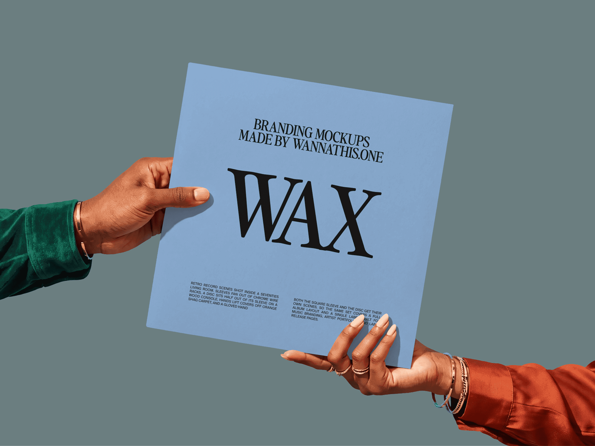 Two arms reaching in from opposite sides to pass a vinyl record sleeve across