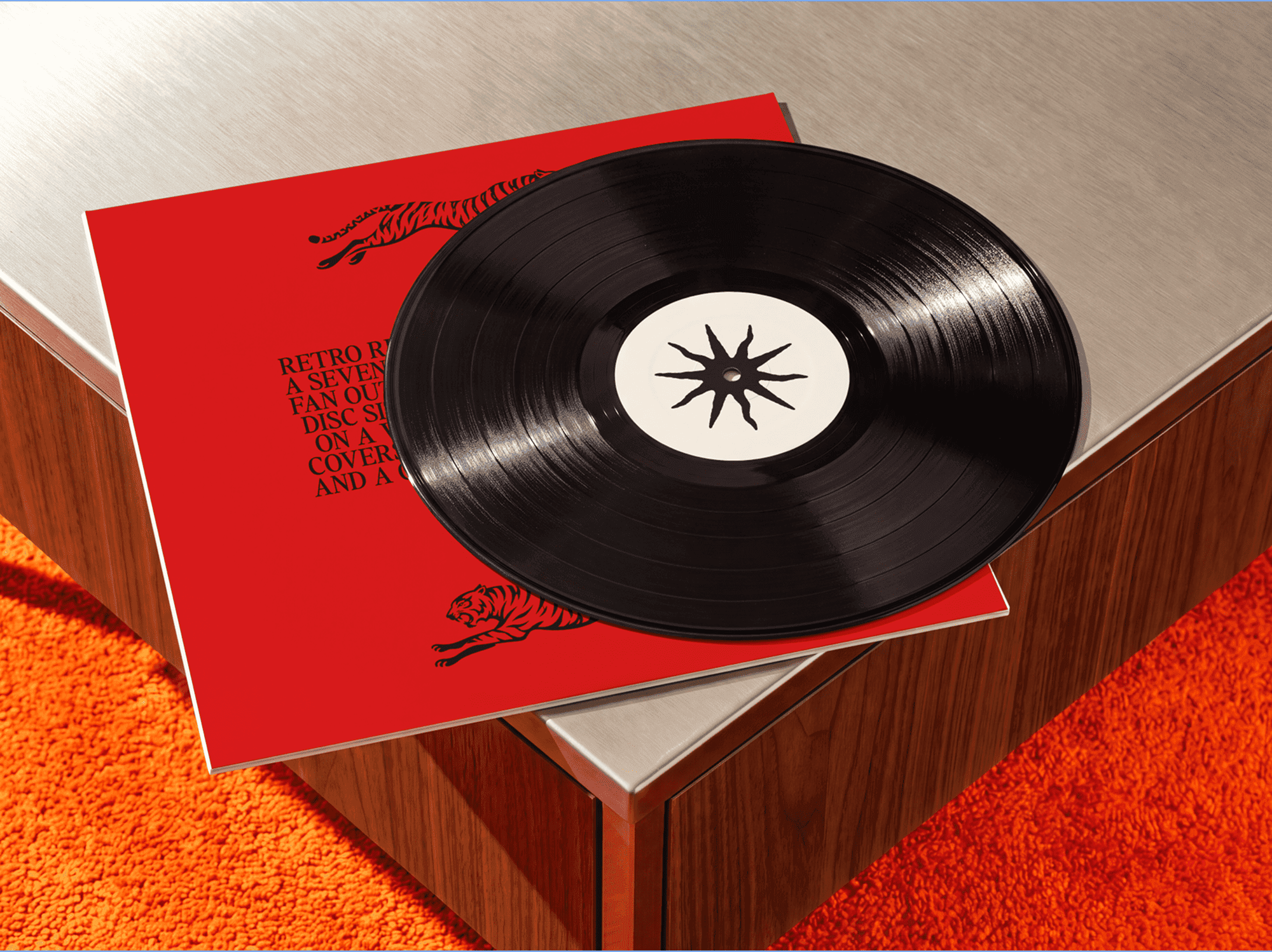 Vinyl record lying on top of its album sleeve on a flat table surface