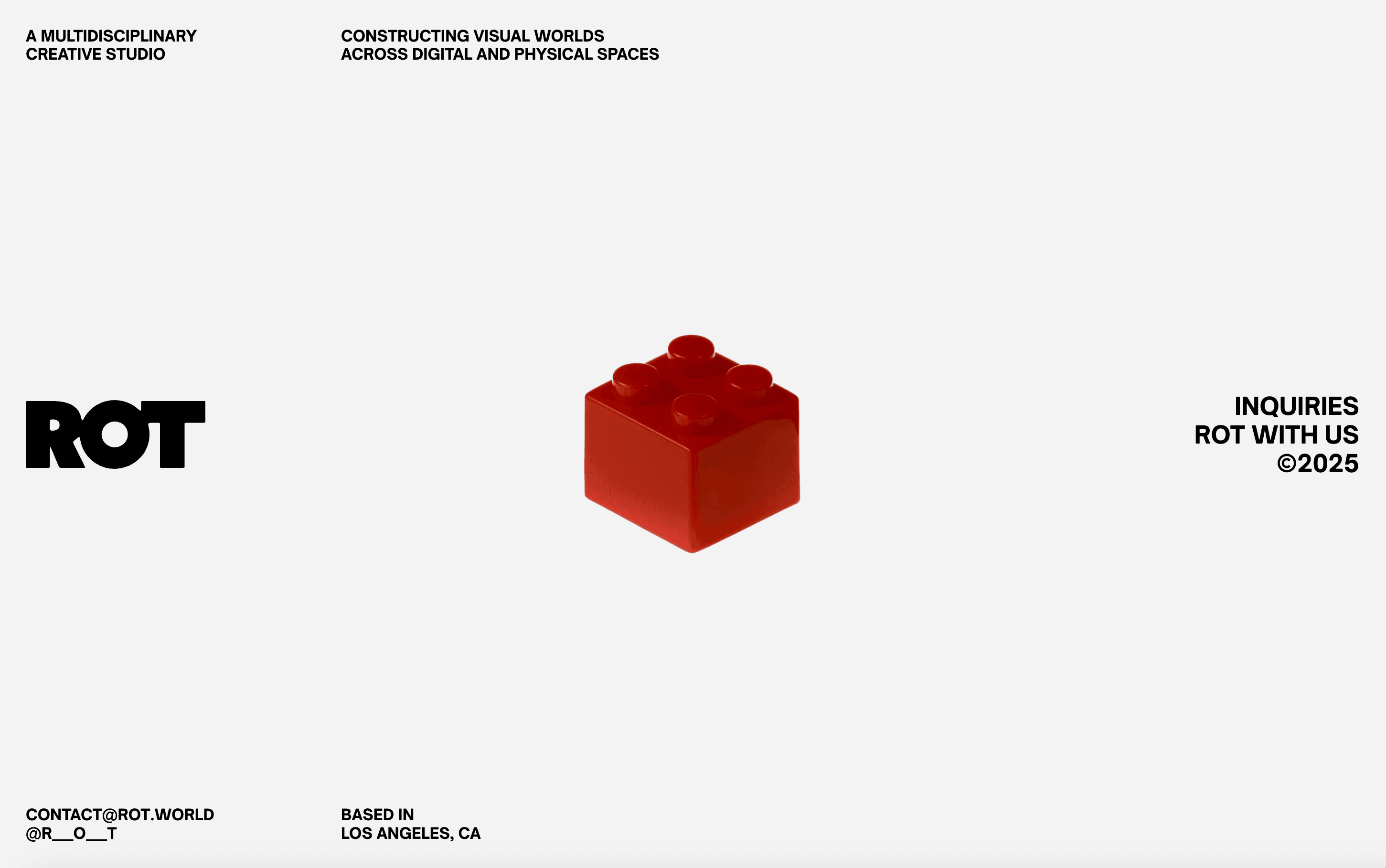 Minimalist web layout featuring a red block on white background — modern creative studio branding.