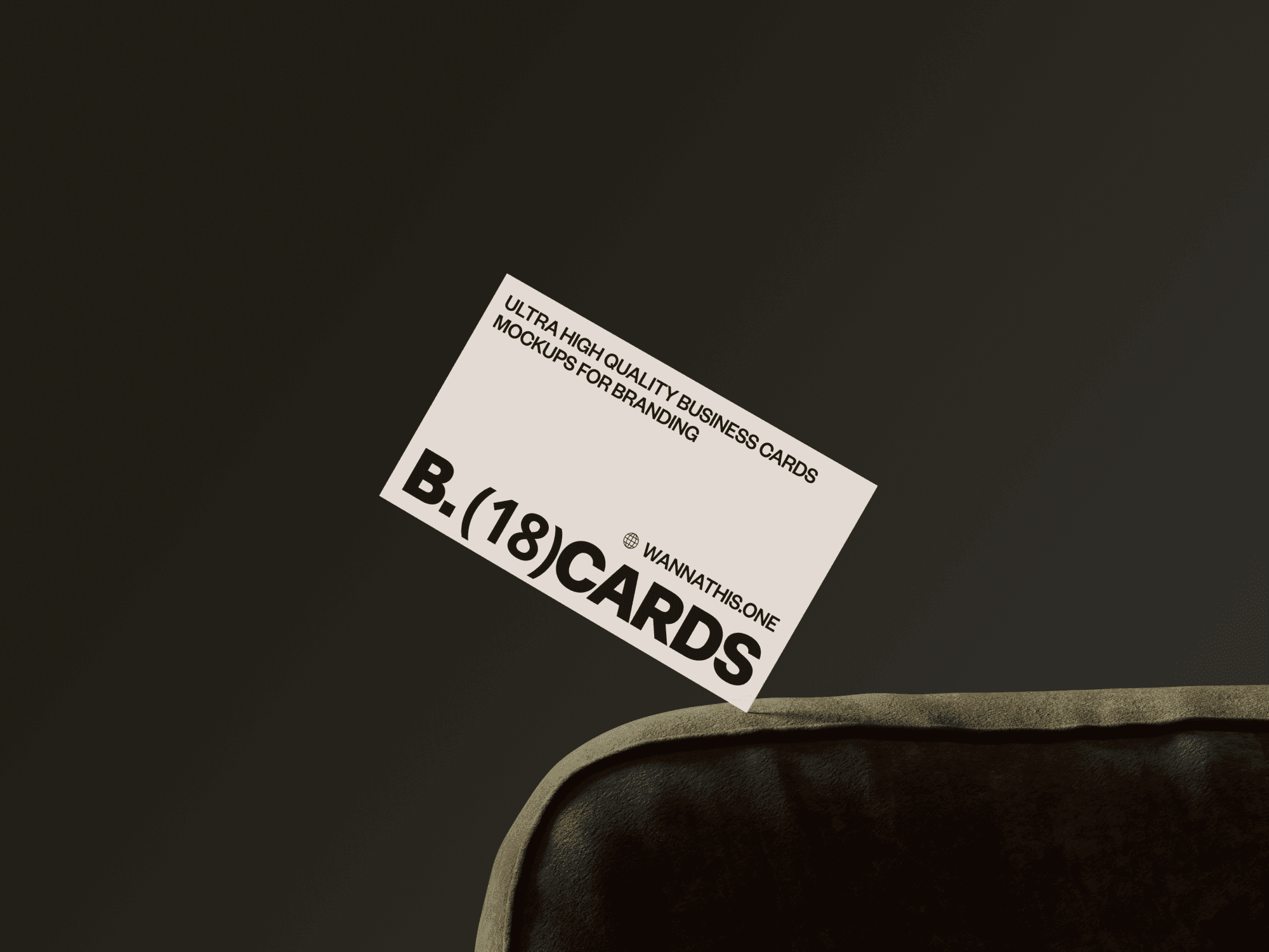 Business card mockup leaning against a plush brown couch.