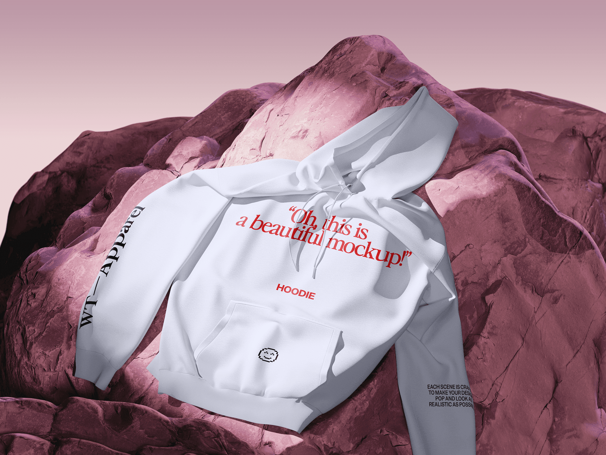 A white hoodie mockup laid on pink rocky terrain under soft gradient lighting.