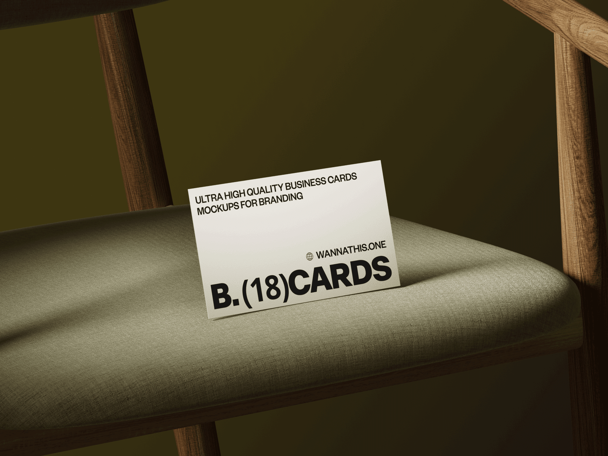 Business card mockup positioned on the edge of a leather chair.