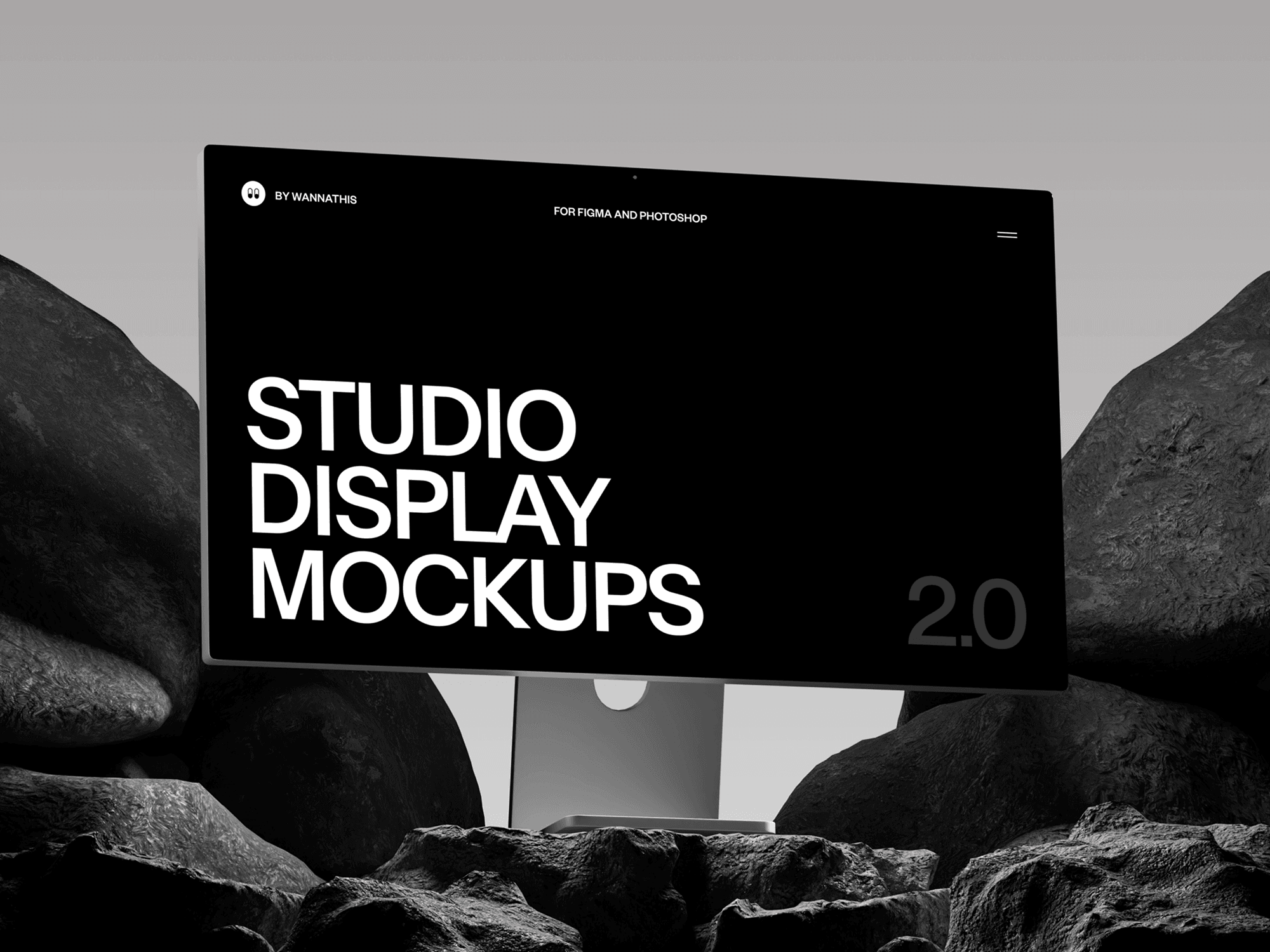 Studio display mockup placed on rugged rocks with a bold black screen design