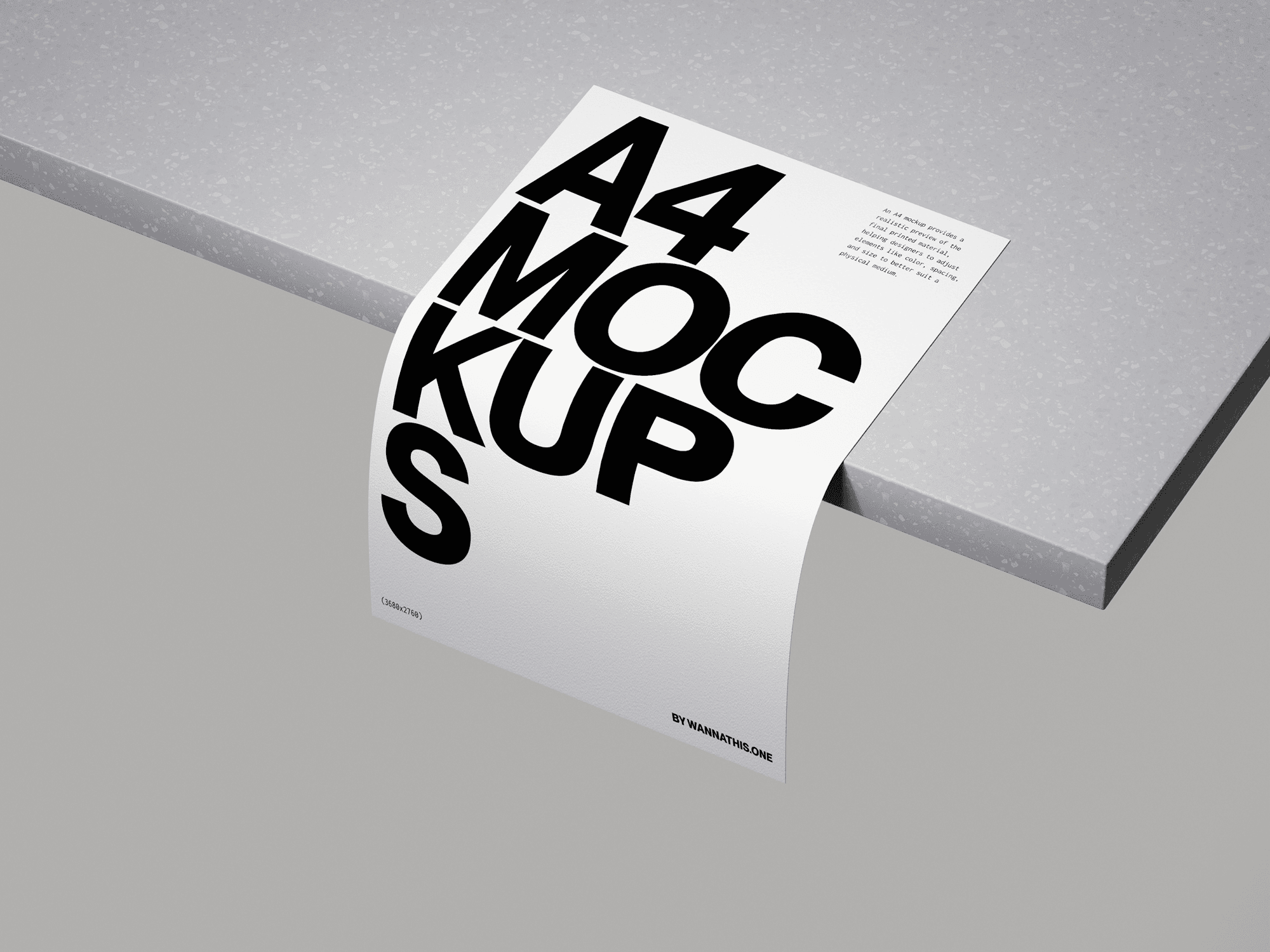 A white A4 paper mockup with bold typography bending over the edge of a speckled countertop.