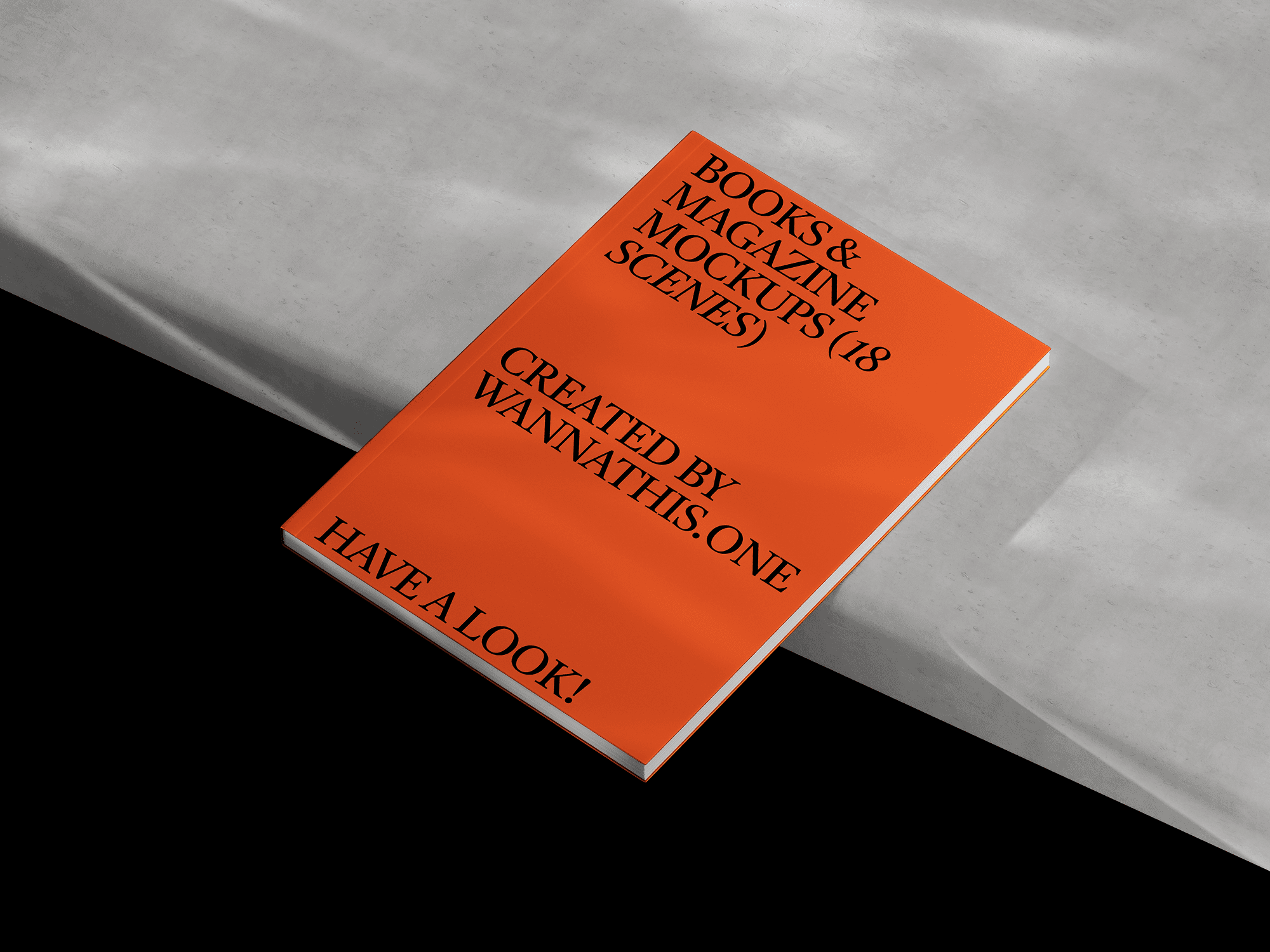 A book mockup with an orange cover lying on a concrete surface