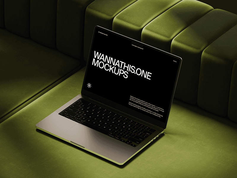 MacBook mockup positioned on vibrant green sofa cushion