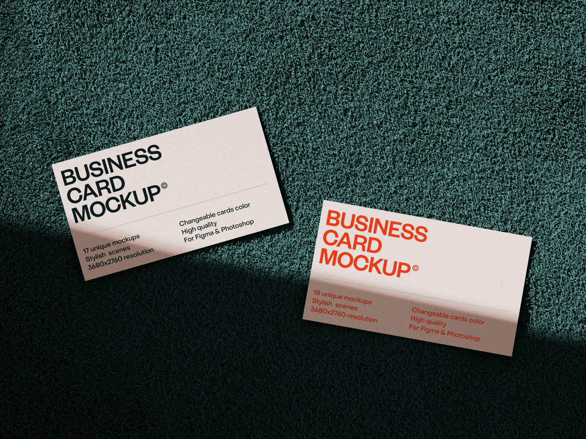 Two business cards on green textured fabric