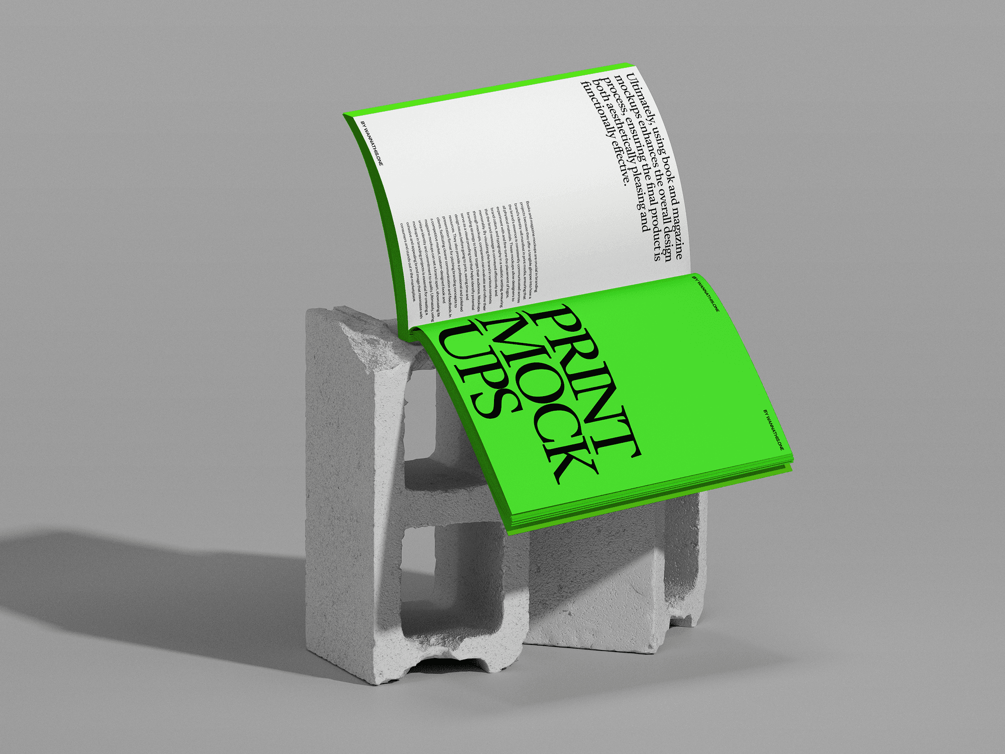 An open book mockup with green pages placed on a cinder block