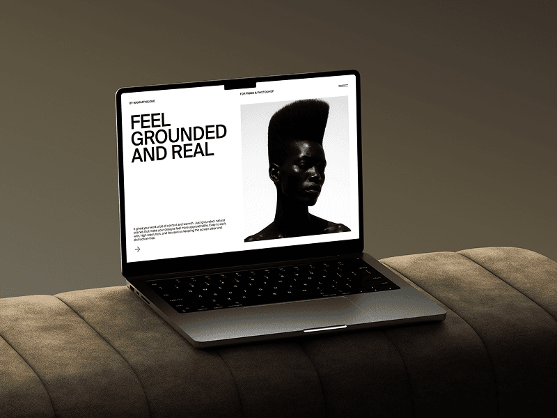 MacBook mockup placed on beige velvet sofa in soft lighting