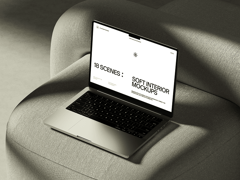 MacBook mockup resting on a soft light brown chair in interior setup