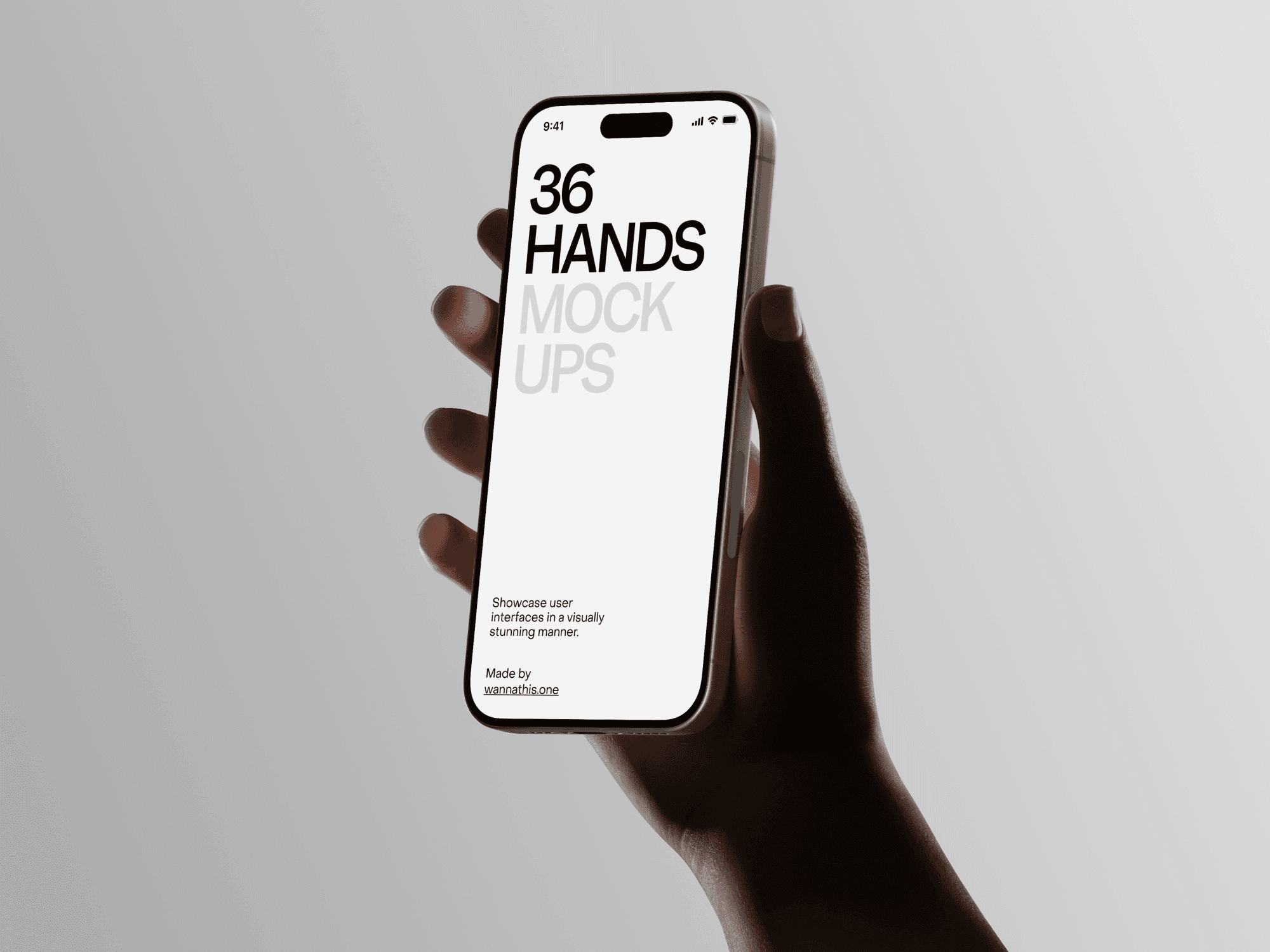 Hand holding an iPhone with a white screen in a soft light environment