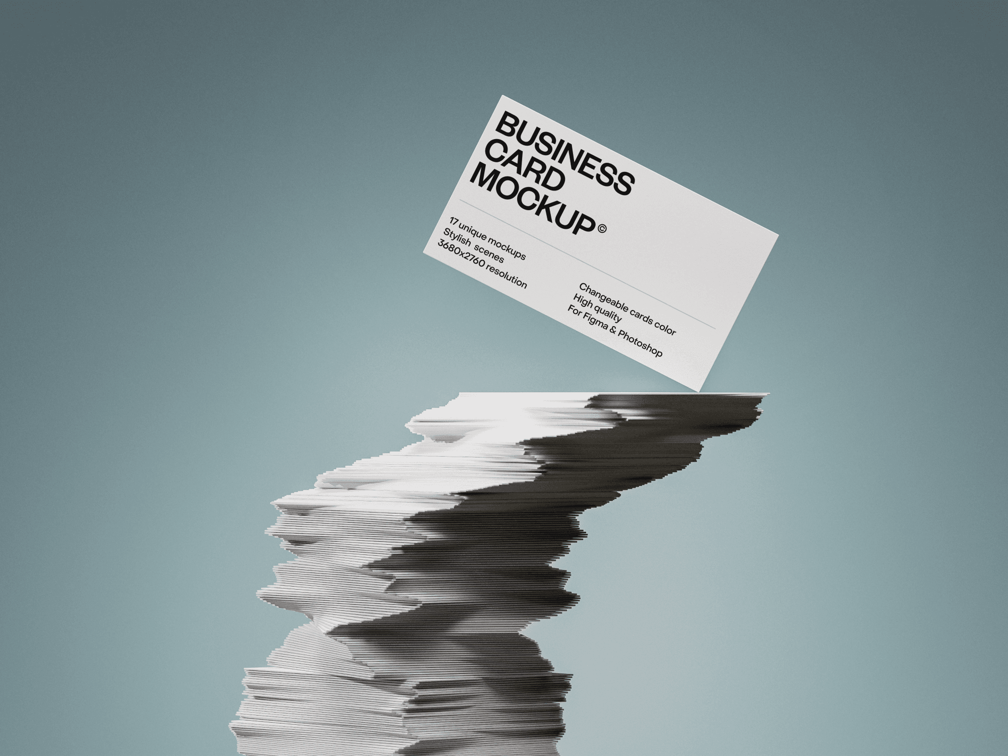 Stacked business cards with one card floating on top.