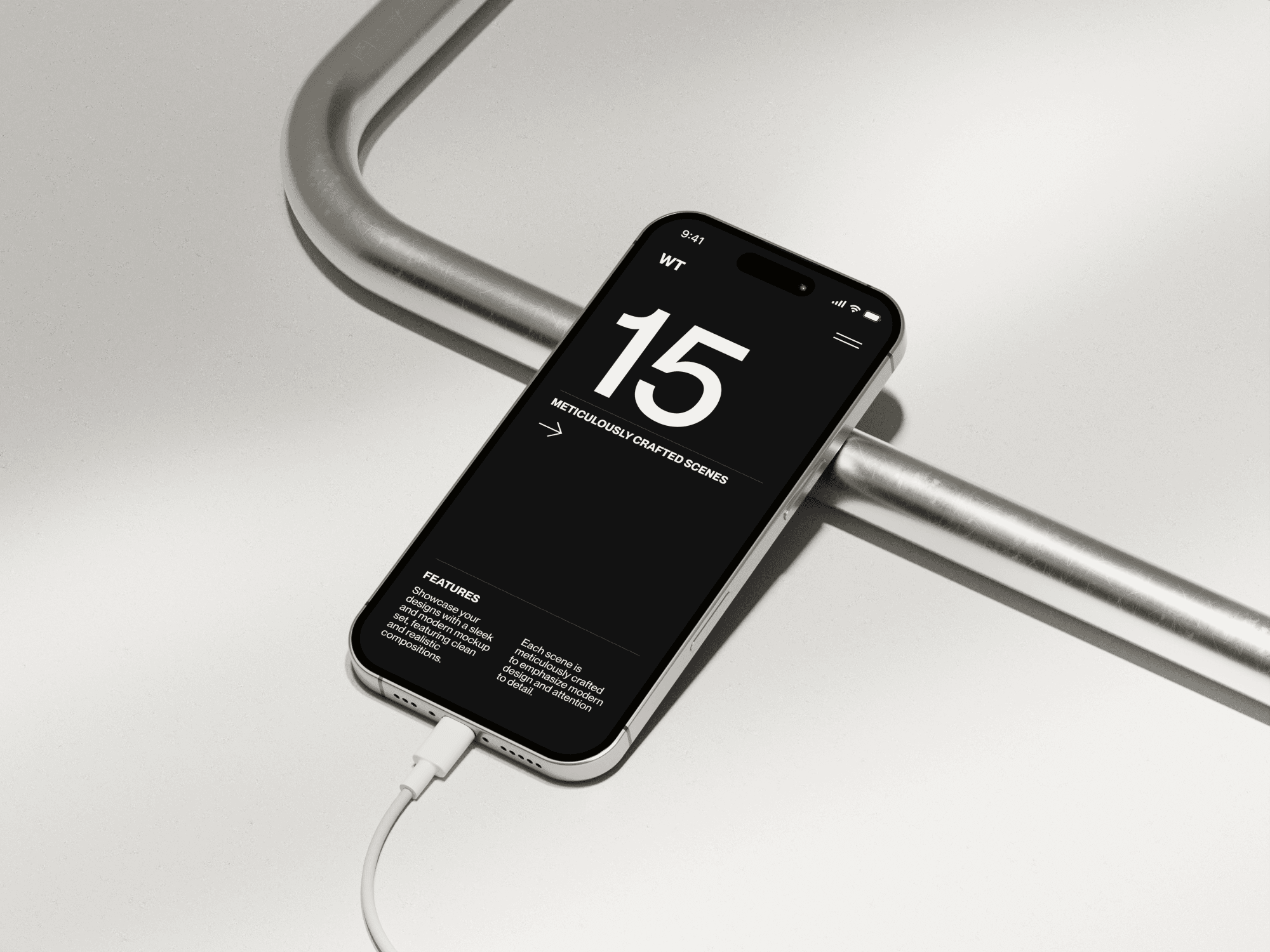 iPhone 16 mockup resting on a metal bar with a charging cable connected.