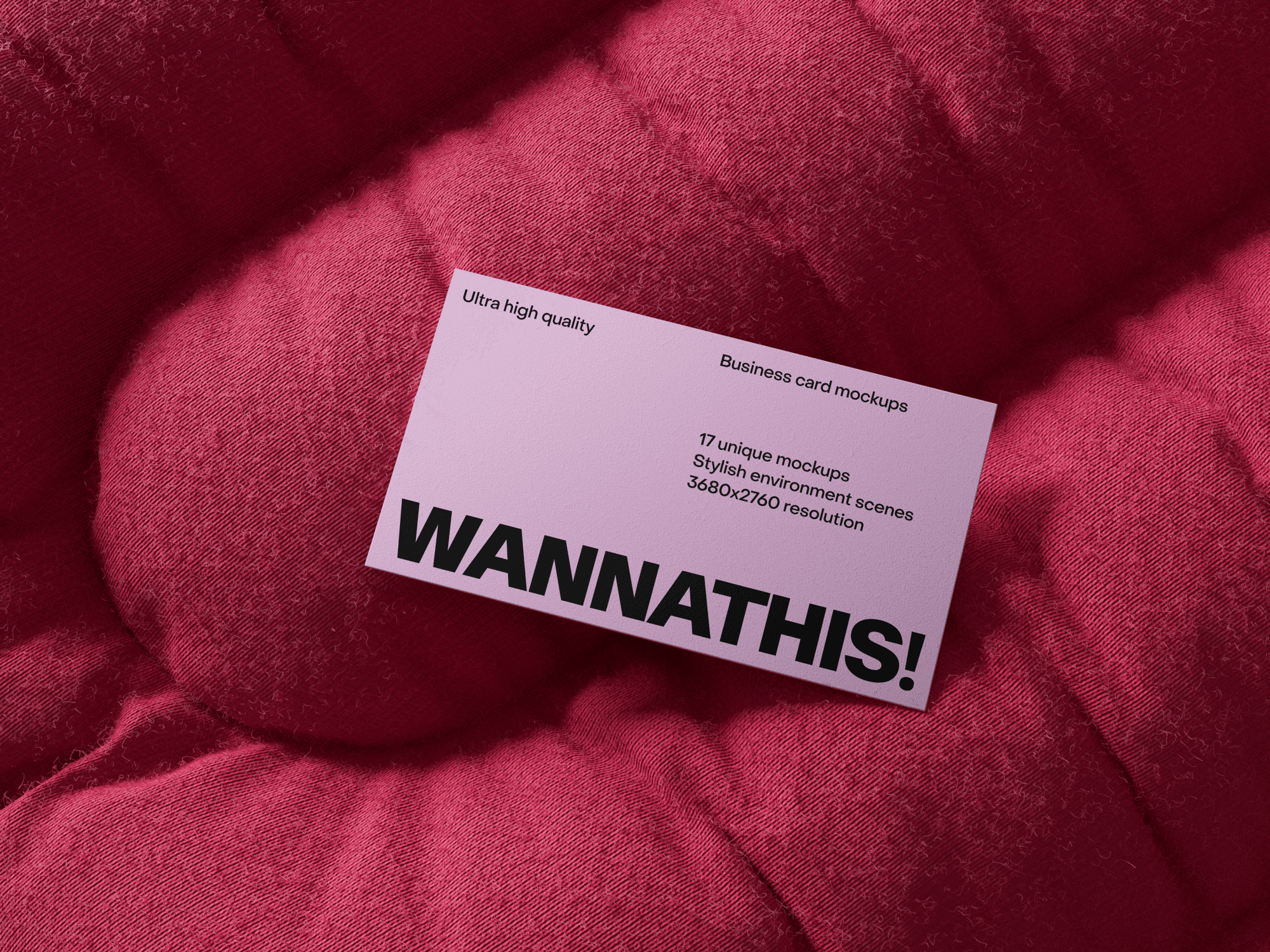 Pink business card mockup placed on a soft cushioned background.