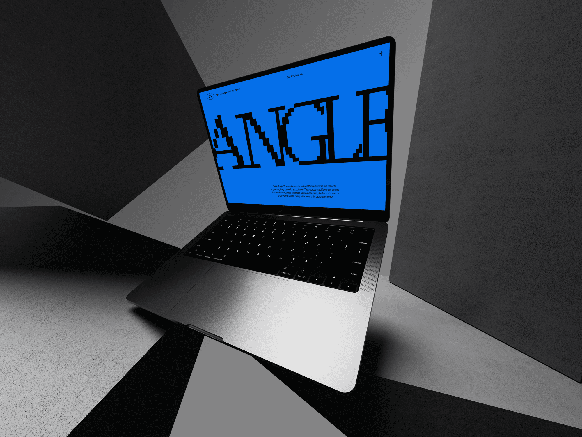 MacBook in a minimal black and white abstract room