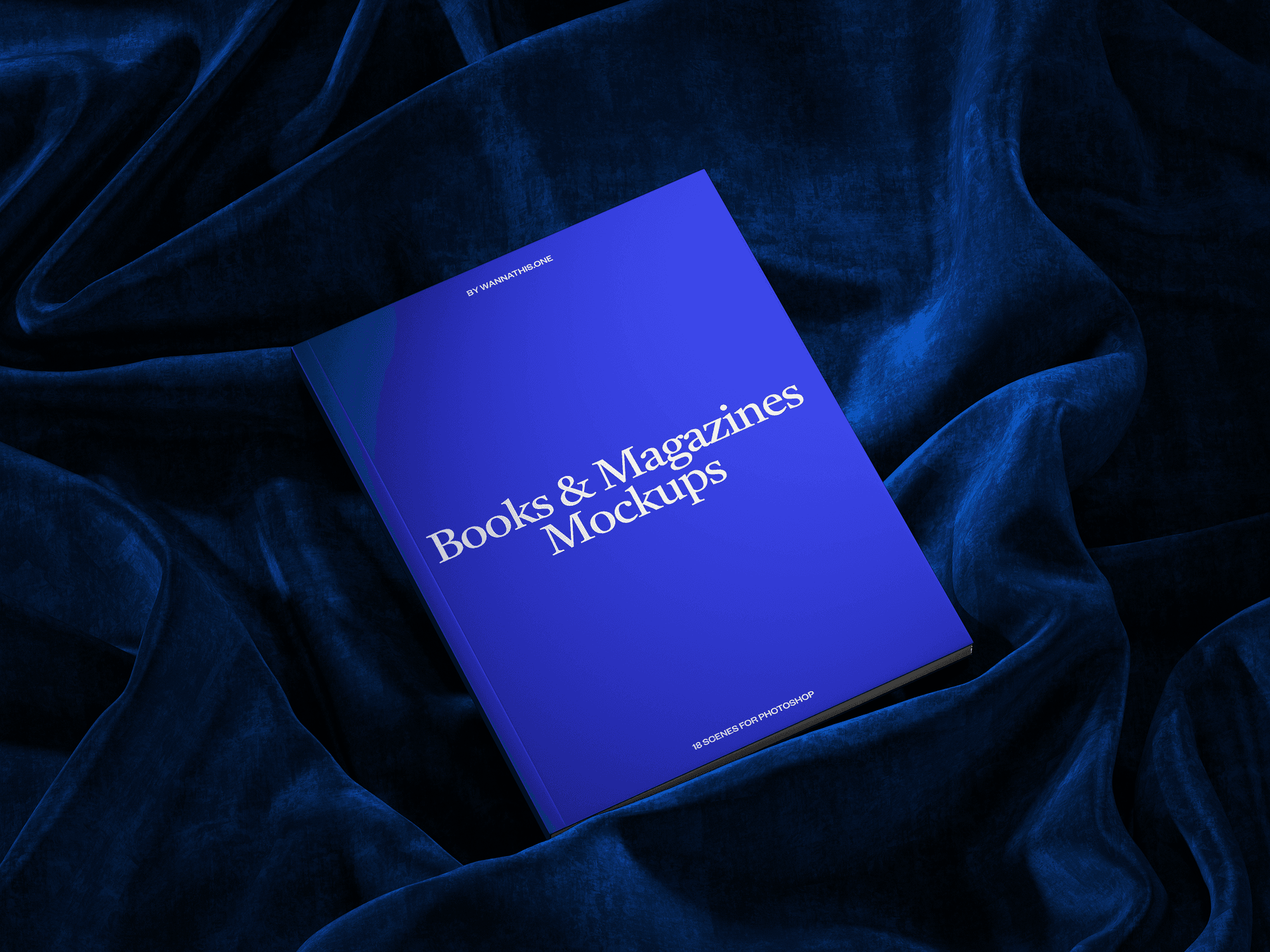 A book mockup resting on luxurious dark blue velvet fabric