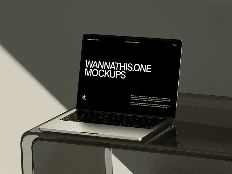 MacBook mockup placed on dark tinted glass tabletop