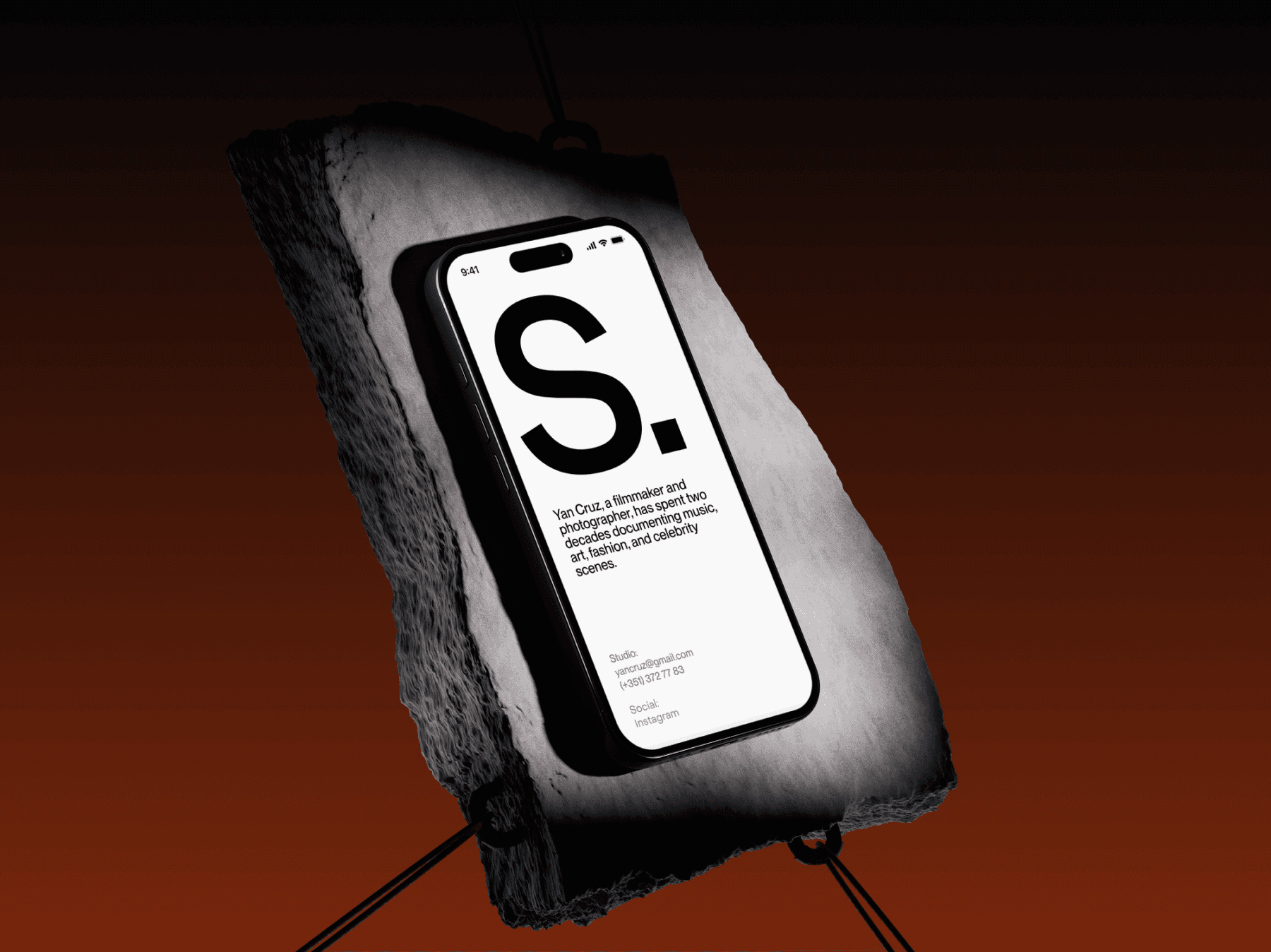 Smartphone mockup placed on a rough stone surface with dramatic lighting