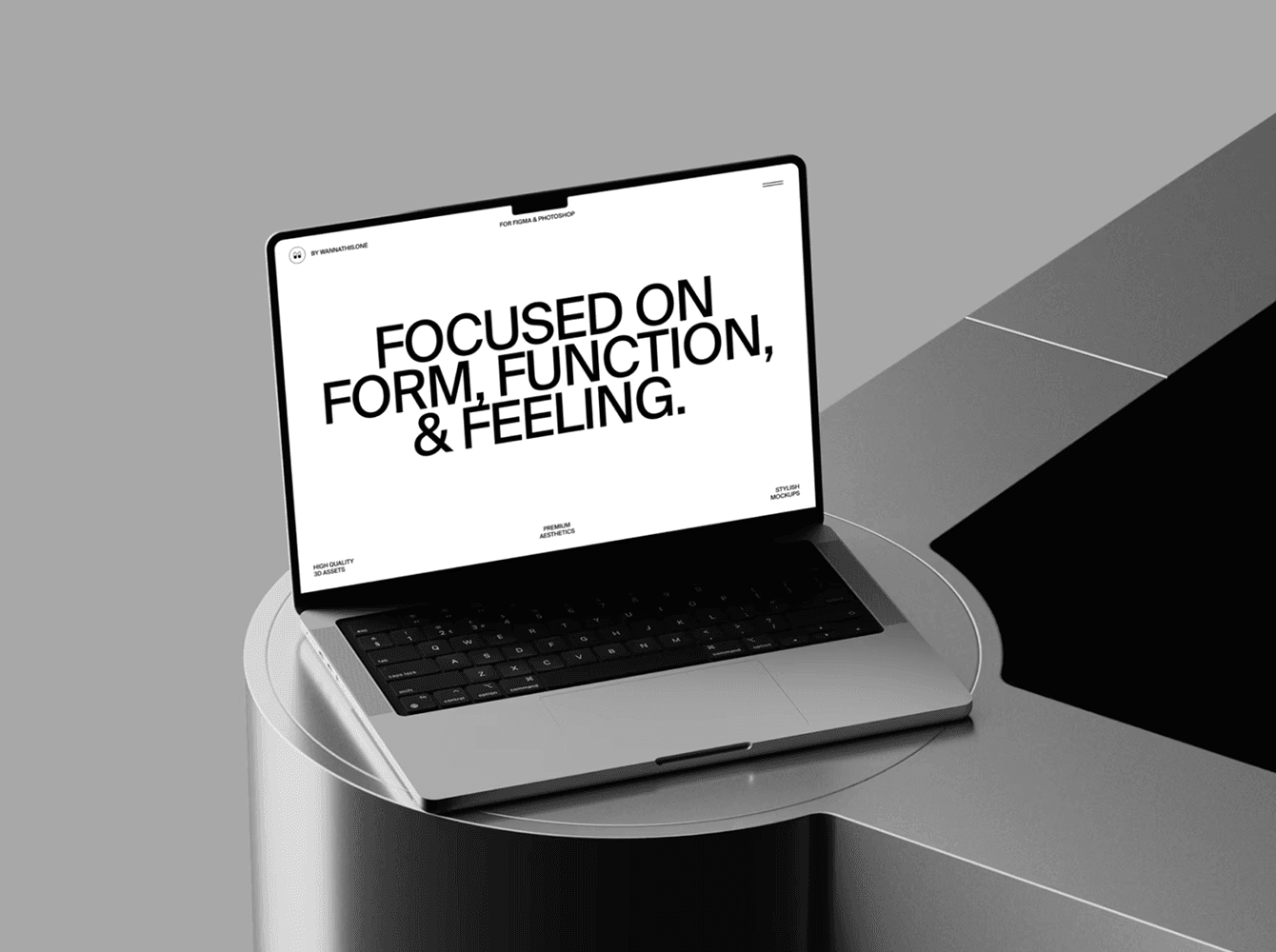 MacBook laptop mockup with bold typography screen on round metal table, by Wannathis