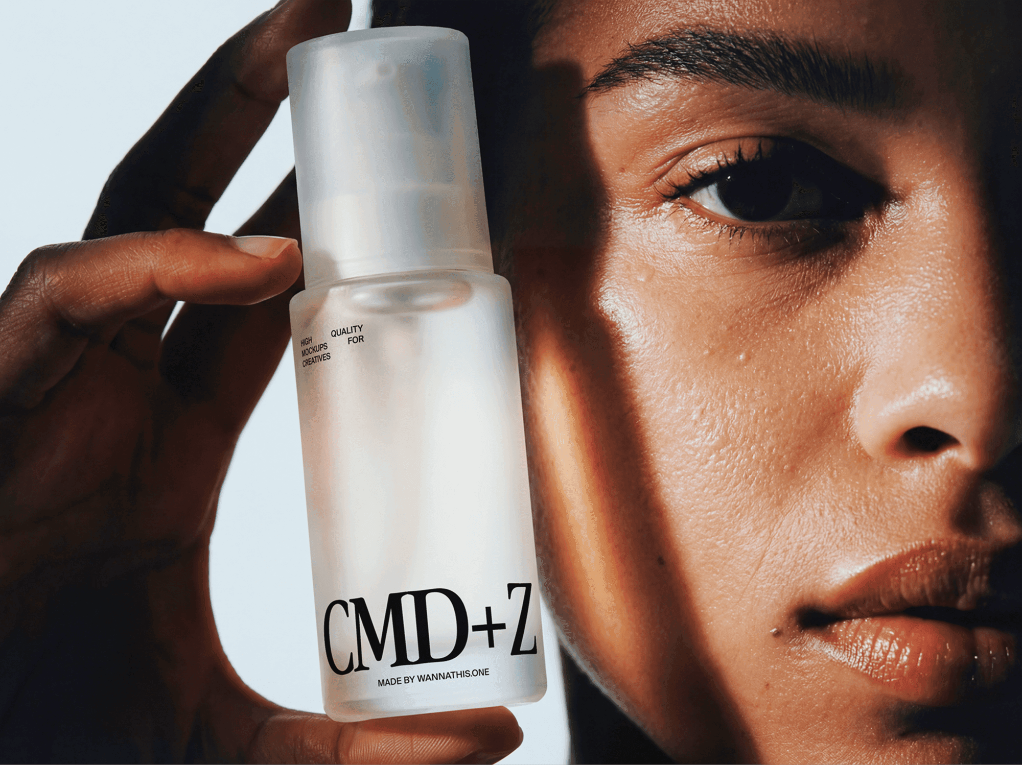 Skincare serum bottle mockup held next to a person's face in a refined beauty portrait studio scene