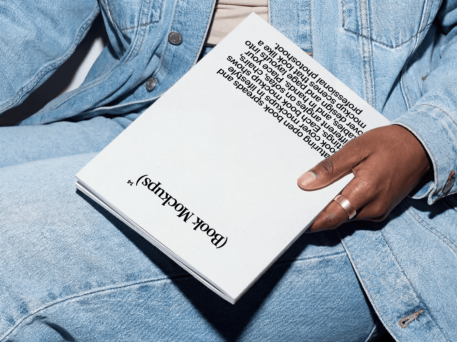 Softcover book resting on a person's lap in a casual setting