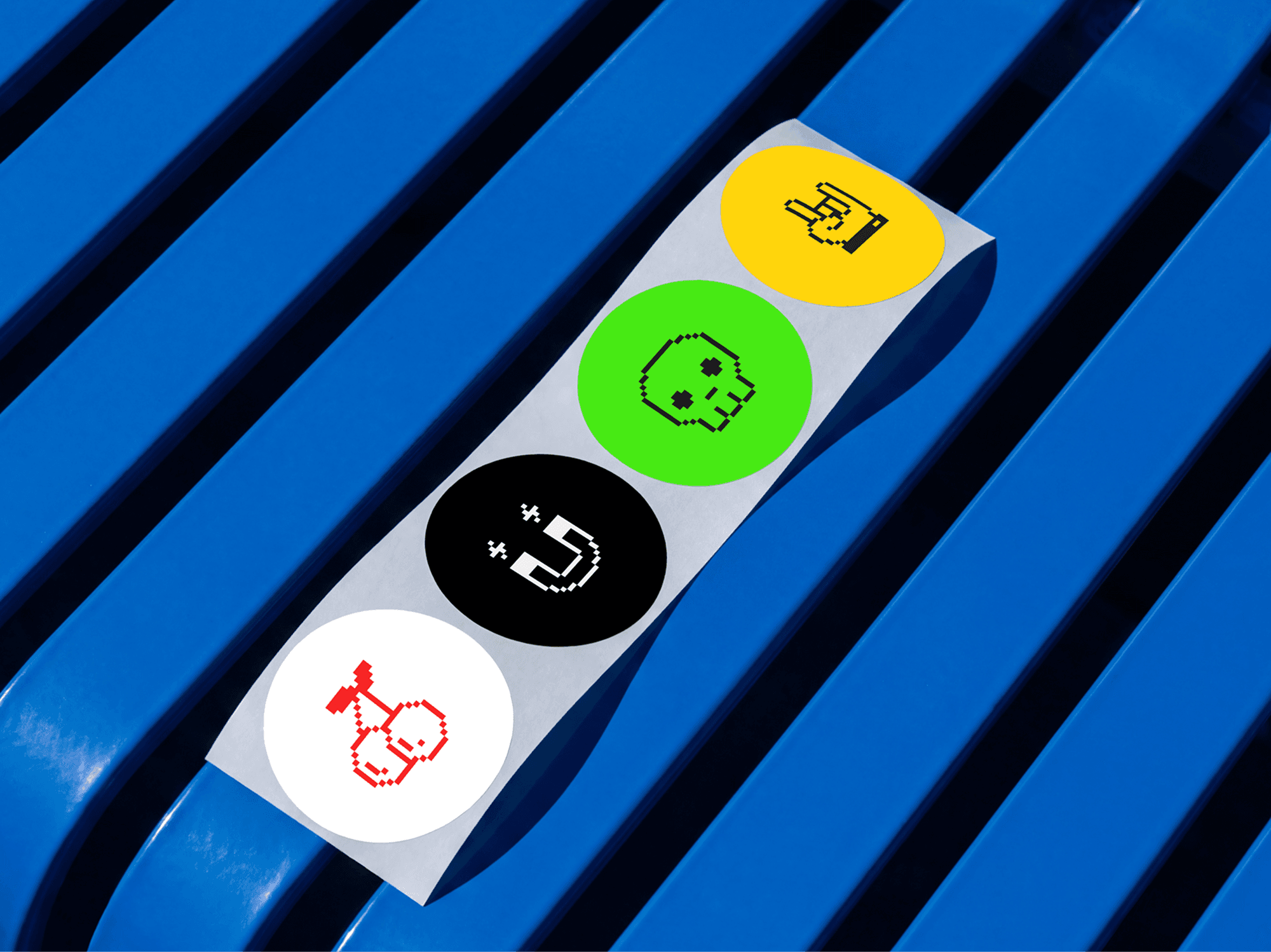 Sticker sheet with multiple round stickers placed on a textured refined surface in a clean studio scene