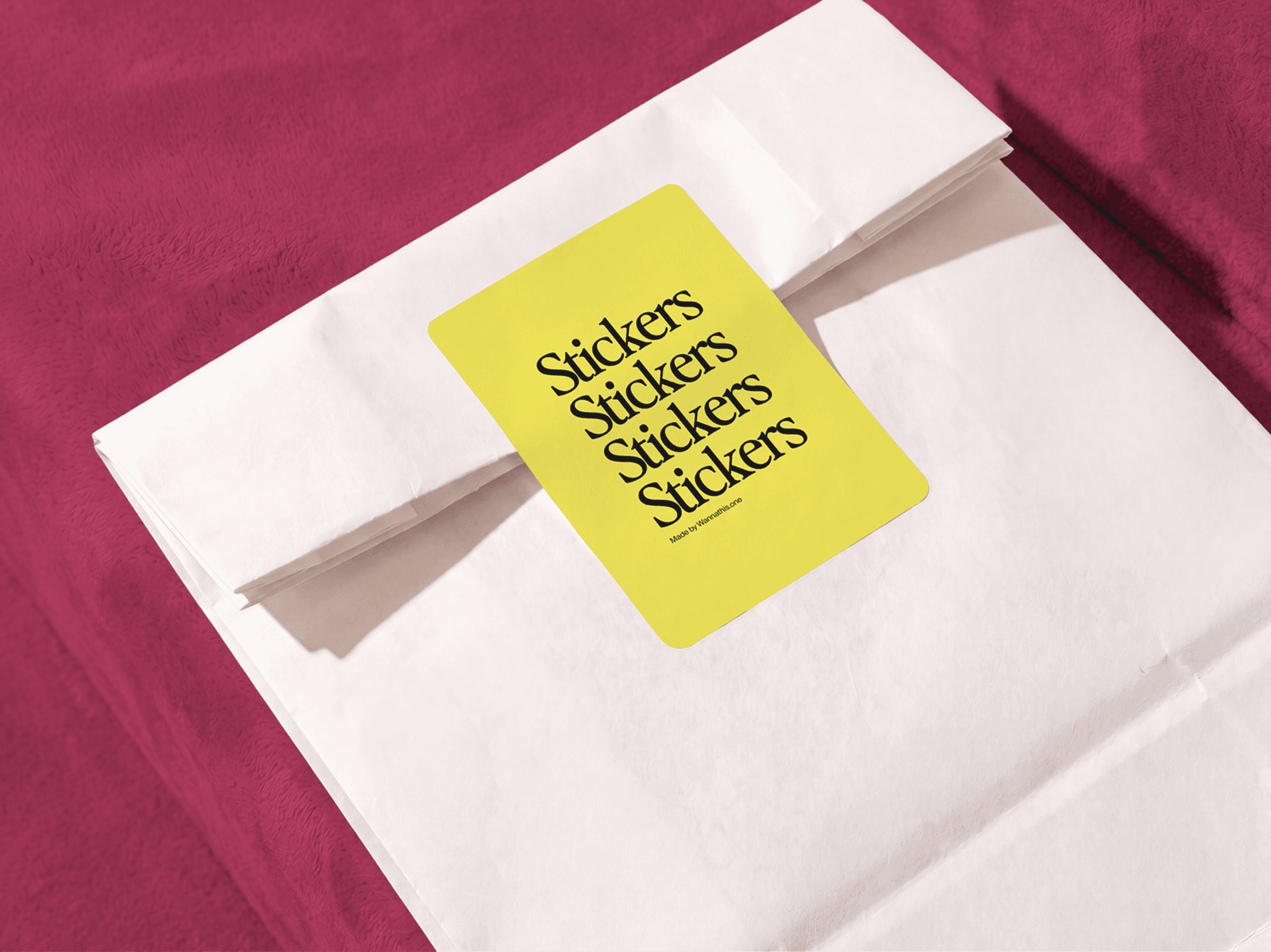 Round sticker mockup attached to a folded paper bag in a refined minimal studio composition scene