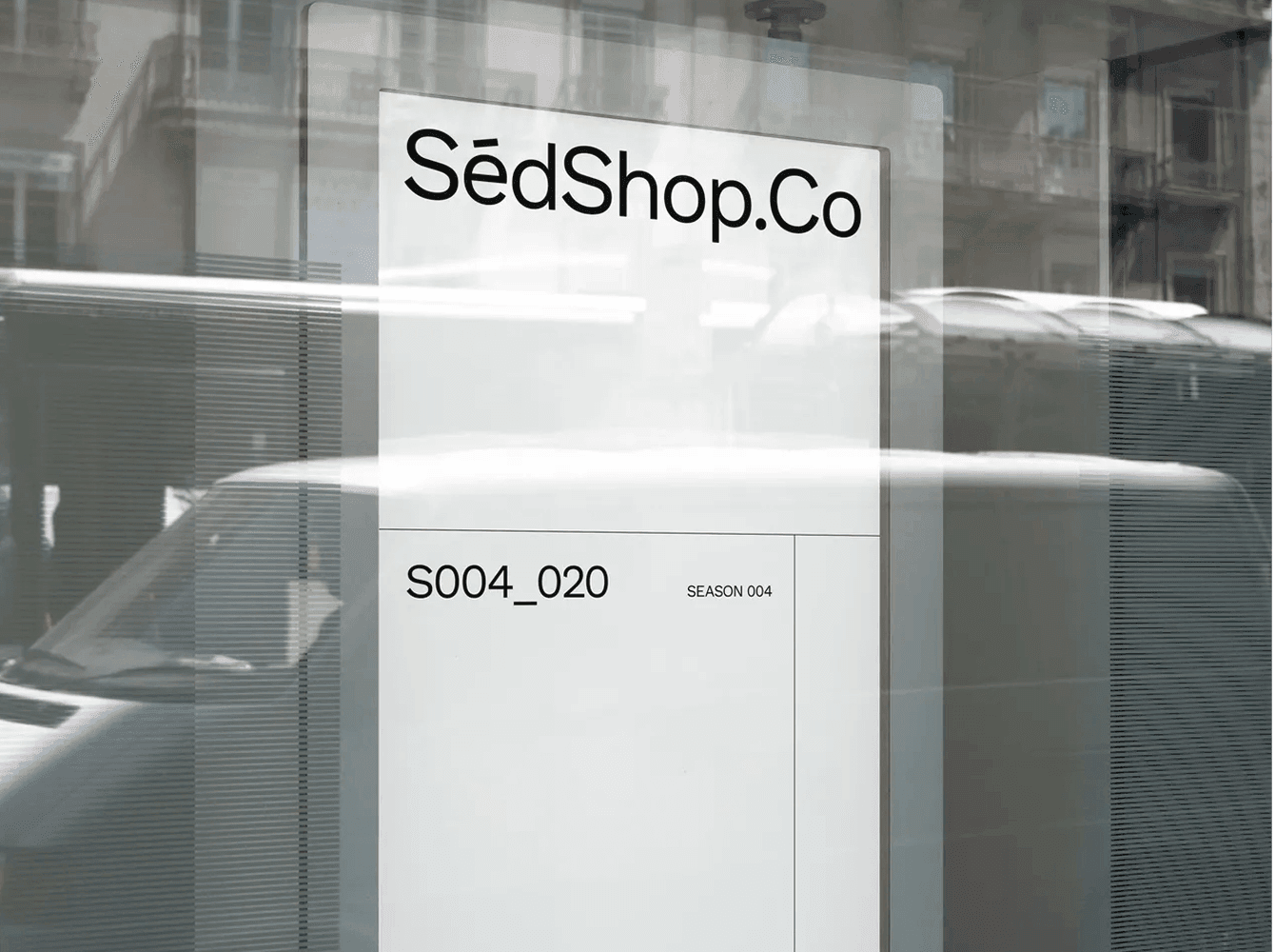 Storefront poster mockup on glass window with reflections