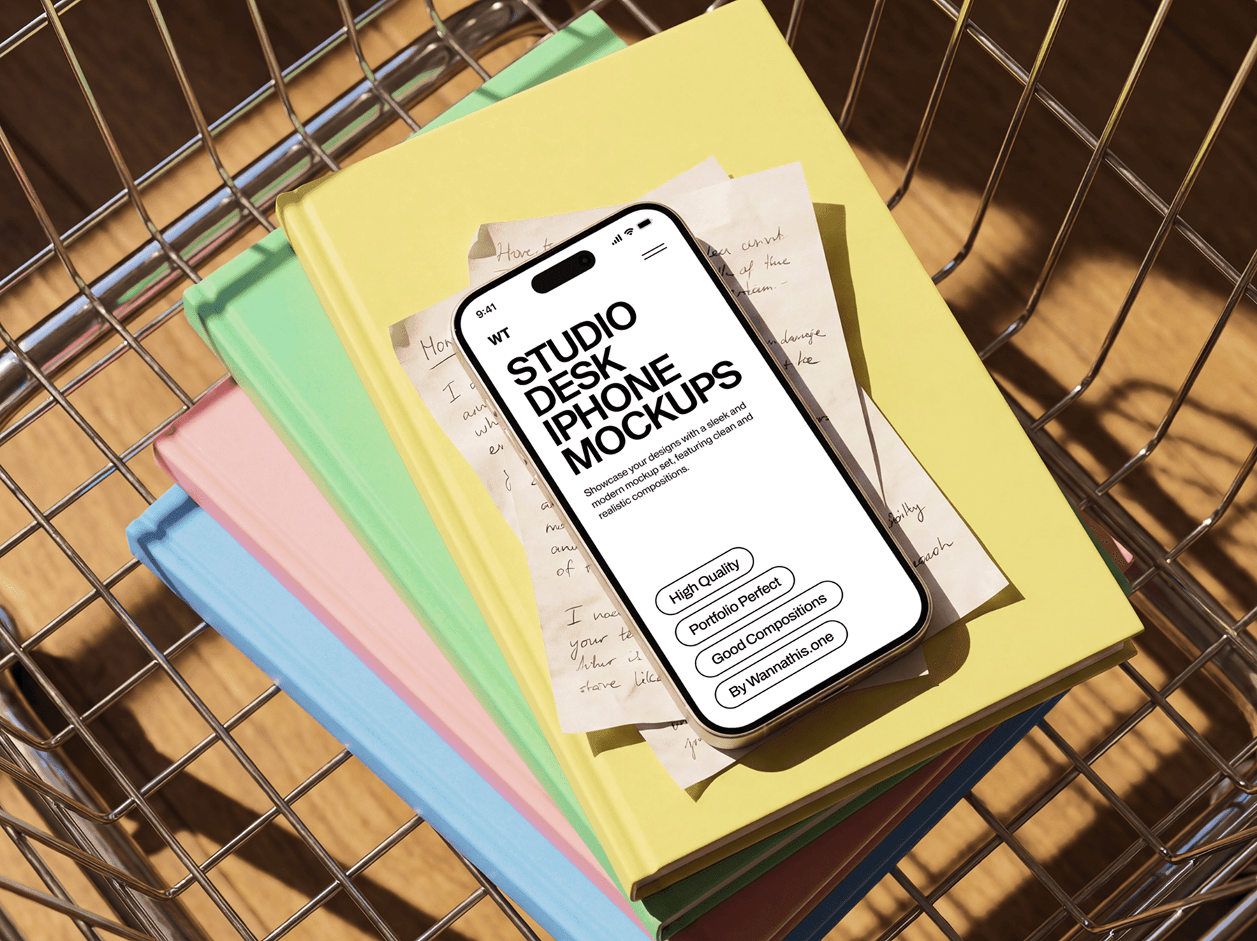 iPhone mockup placed on top of stacked notebooks in a creative desk setup