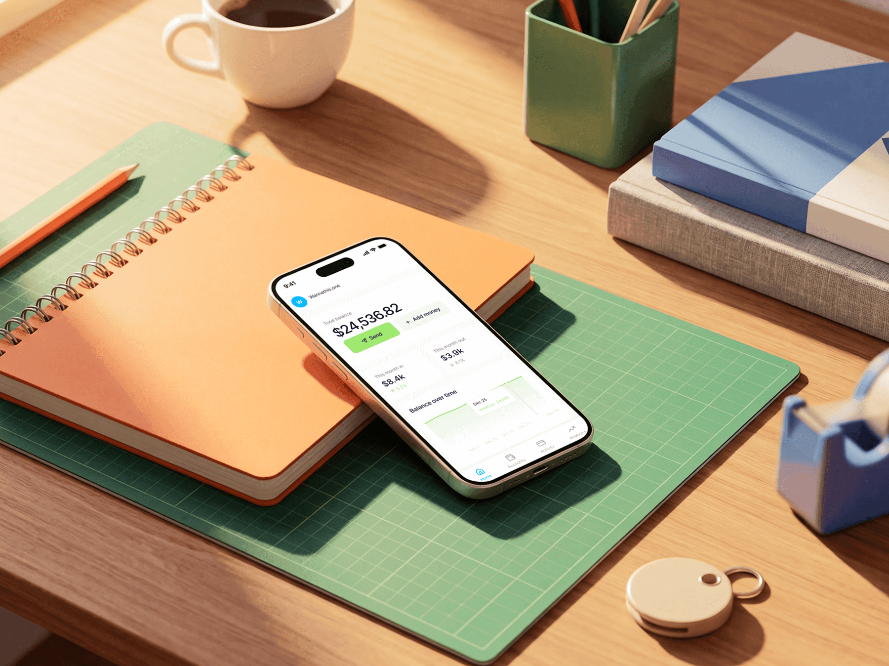 iPhone mockup lying on a desk next to a notebook and workspace tools