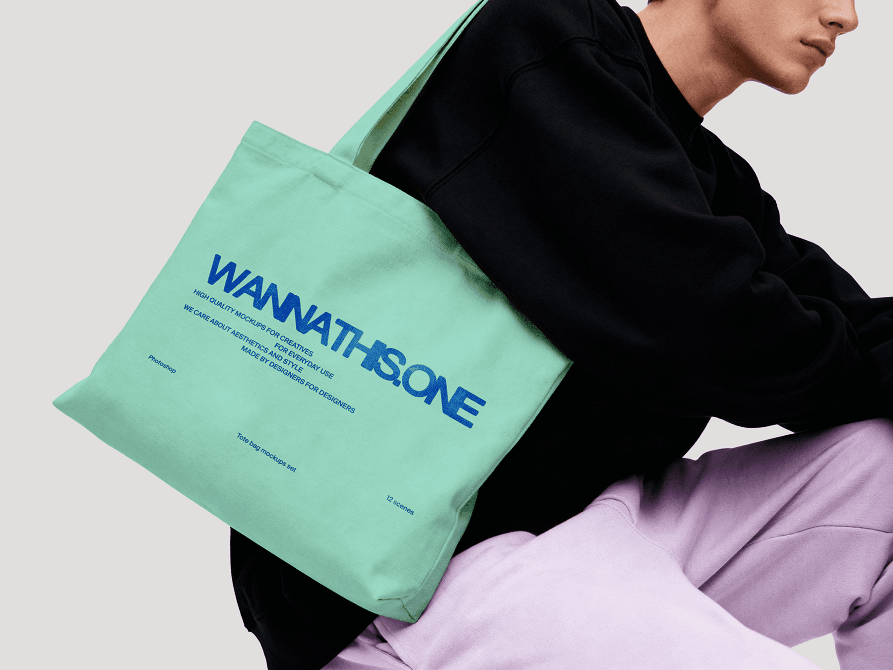 Tote bag mockup worn by a model standing in a minimal studio