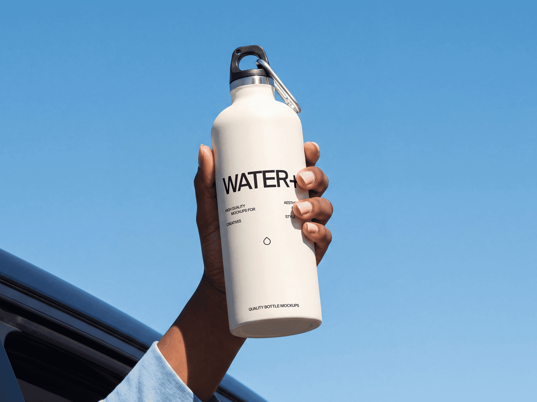 Travel bottle mockup lifted upward against an open sky outdoors in a refined natural daylight scene